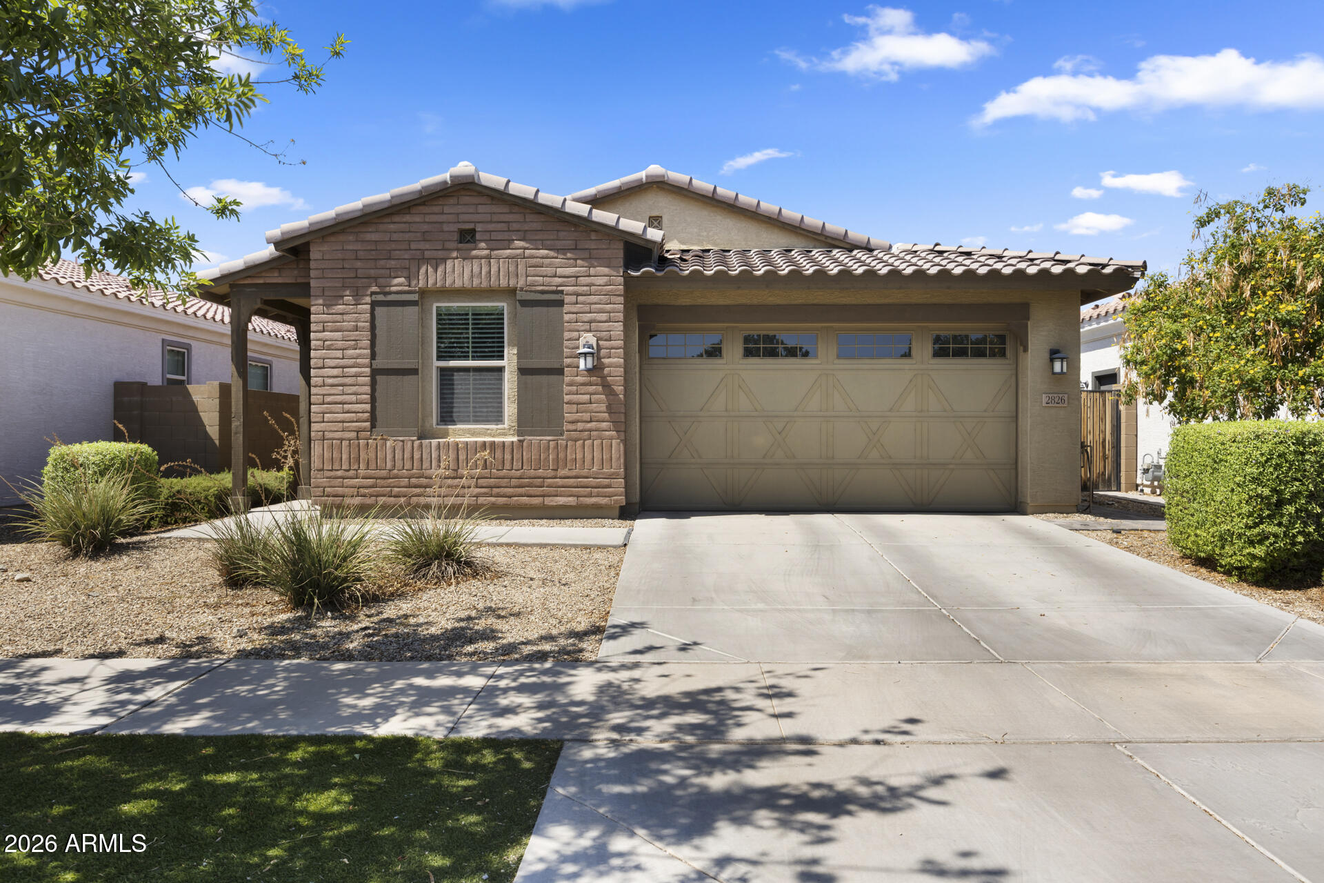 Welcome to this beautifully maintained 4-bedroom, 2-bath home in the gated Southern Enclave community! Built in 2018, this move-in ready home features a bright open-concept floor plan with abundant natural light, oversized sliding glass doors, and durable laminate flooring throughout. The kitchen offers granite countertops, a breakfast bar, pantry, and flows seamlessly into the living and dining areas--perfect for everyday living and entertaining. The spacious primary suite features dual sinks and a custom glass walk-in shower. Step outside to a covered patio and a low-maintenance backyard with premium turf. Enjoy the privacy and convenience of a gated community with five private parks, all just minutes from Downtown Phoenix, Sky Harbor Airport, shopping, dining, and major freeways.