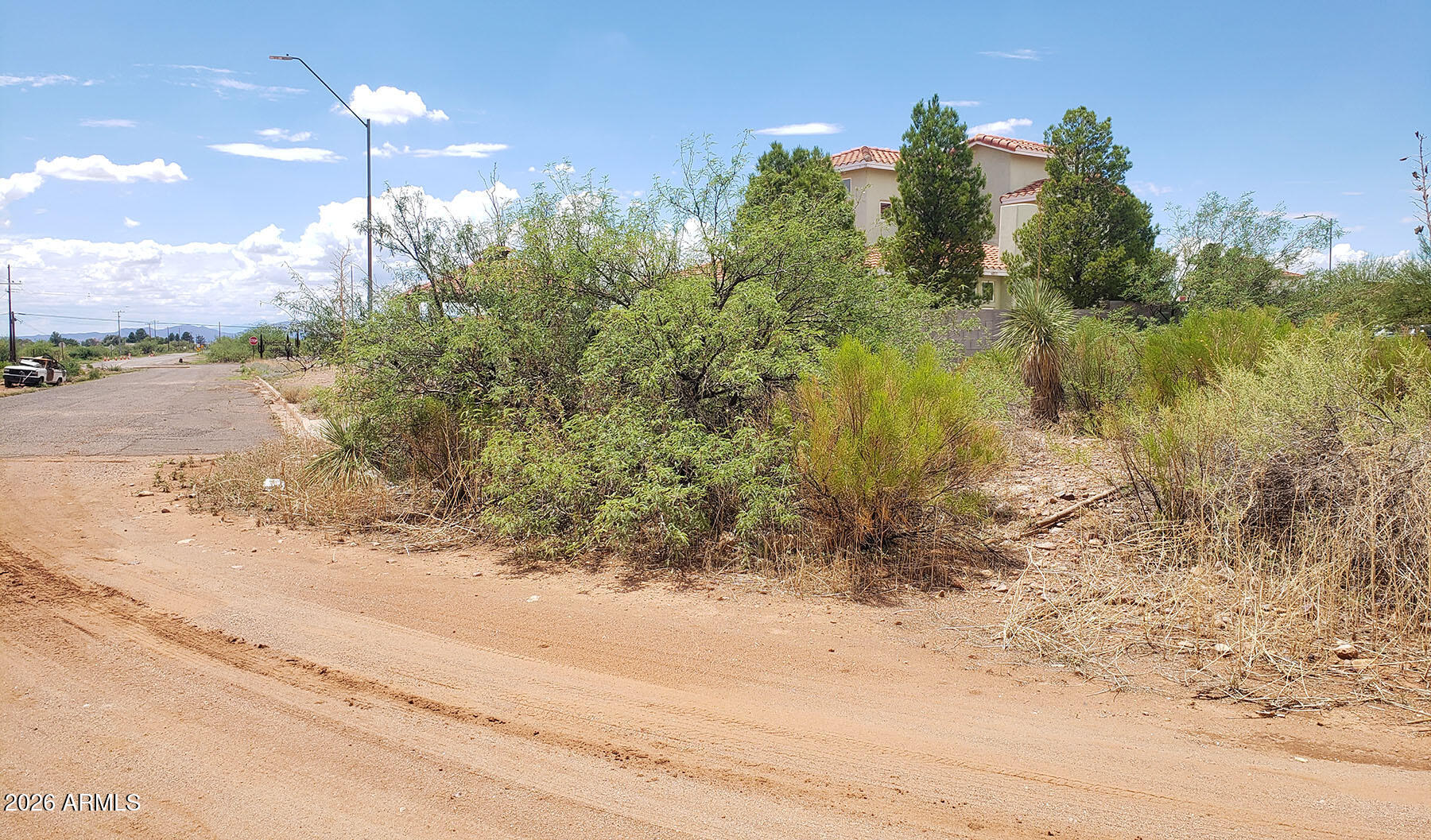 Build-ready residential corner lot in the established Coronado Hills Subdivision of Douglas, Arizona. This 0.2-acre parcel is ready for your new single-family home with water, electric, and sewer utilities available. Buyer to confirm connections to lot. Fully paved access from Highway 80. Thriving neighborhood with quality newer homes. Douglas provides residents with a full range of community amenities including a library, city recreation centers, an Olympic-size swimming pool, an indoor aquatic center, seven parks, a golf course, and tennis and racquetball courts. The area is also within walking distance of the Douglas golf course, with hotels, shopping, restaurants, a fire station, post office, banks, medical facilities, and churches all nearby.