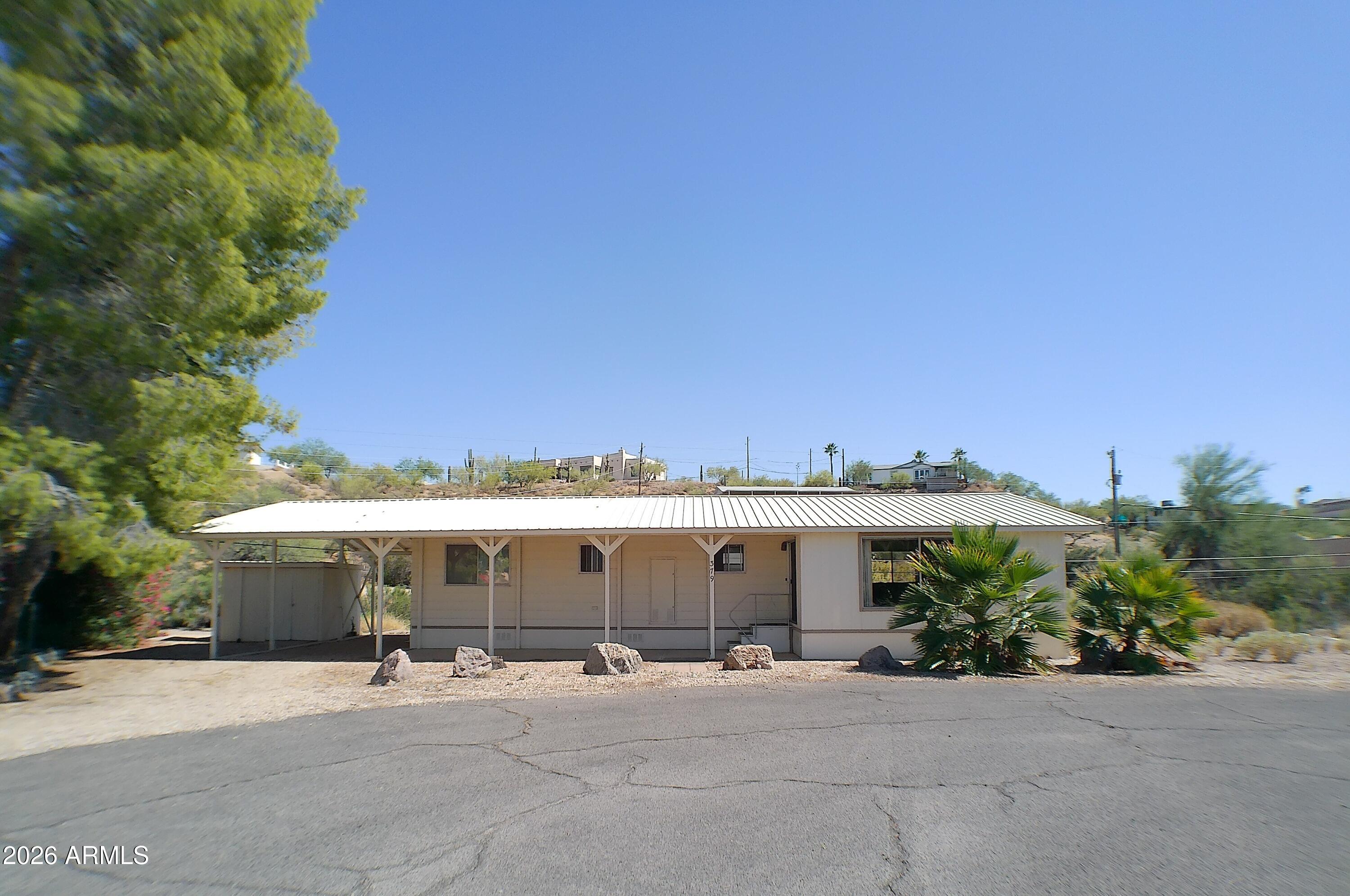 Charming, Well-Maintained Home on a Quiet Cul-de-Sac Near Queen Valley Golf Course!

This cozy and fully furnished 1-bedroom, 1-bath home offers comfort, convenience, and classic Arizona living. Located just minutes from the Queen Valley Golf Course, it features a 32x8 screened-in Arizona room perfect for relaxing and enjoying the evenings.

A covered carport provides shaded parking, and the large storage shed includes an outdoor laundry area for added functionality. The property has been well cared for and is move-in ready.