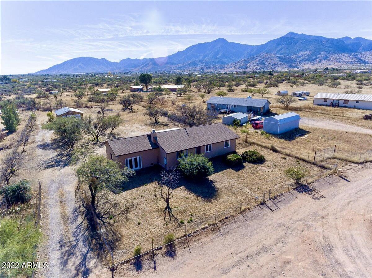 Do you need space inside and out?!! This ranch style, site built home is for you! Highly updated home with 3 bedrooms, 3 bathrooms, 2 spacious living areas and 2 car detached garage with workshop area!!  No carpet, ALL tile, fully redone kitchen with upgraded cabinets that feature pull out shelves, new appliances, and stunning countertops. The first living area features a wood fireplace & recessed lighting. The second living area has an en suite bathroom, exterior access and could be utilized in numerous ways: game room, in law-suite, guest area (easy conversion with existing murphy bed) etc. One acre parcel with incredible mountain views!!  RV hook up and RV parking available! All nestled at the end of a quiet road, no HOA, pride of ownership home! ***Do not use GPS, that way is rough, please follow directions!!!*** South Hwy 92, East on Hereford Road, West on Janice Dr (Edward V Dr.), East on Calle de la Fresca, North on Calle de la Cereza, East on Calle de la Manzana, North on Calle de la Menta, East on Calle del Narcisco, North on Calle de la Rosa, East on Calle de la Palmera, property on Right.