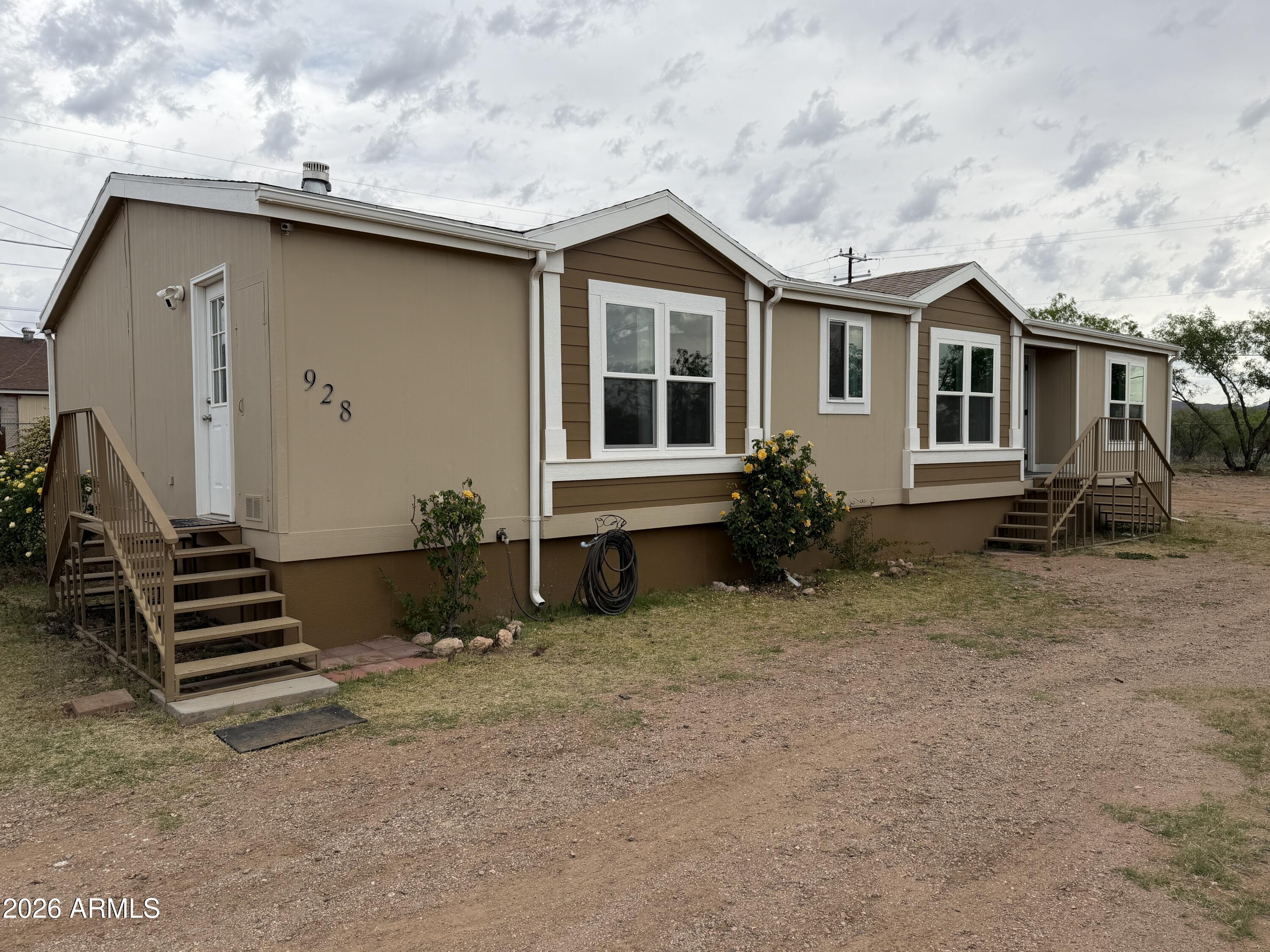 Estate property. Beautiful property. Has been partially remodeled. New windows; new doors (all but 1); front half repainted; new flooring in primary bedroom, living room, two bedrooms, and second bathroom. New toilets, fans, and painted living room.

Gorgeous mountain views. Has separate freestanding garage (needs love), has great potential and solid foundation. Has solid metal stairs at front door and sliding door with beautifully made 10 year old solid metal stairs at the back door. Eight foot fence surrounds the property. Still in decent shape.

This home is being sold ''as-is.'' Come view it today!