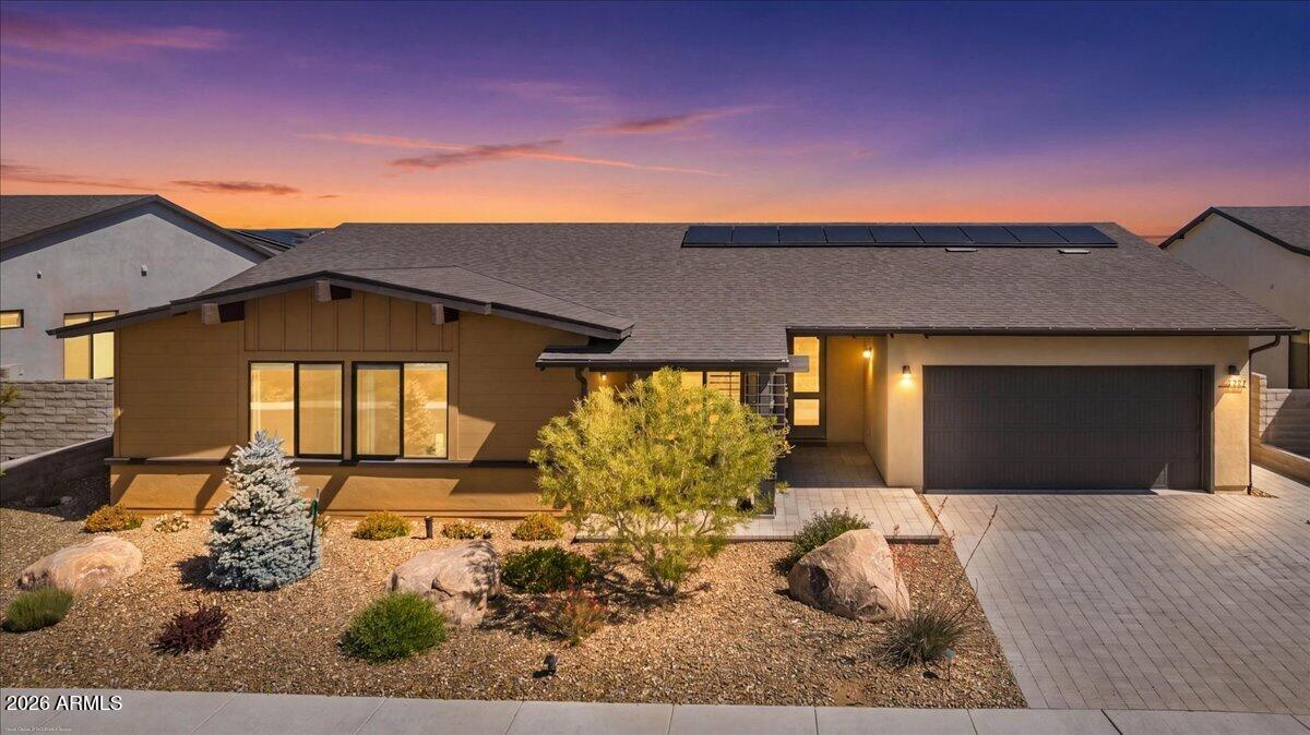 Enjoy modern living in the Jasper Community. This is a well-cared for 3-bedroom, 2 bath, 3 car tandem garage home. The home features an open floor plan including an upgraded gourmet kitchen & appliances. There is a large kitchen island, plenty of cabinet space, & pantry. Living room features a gas fireplace & plenty of natural light from oversized windows. Primary has a large walk-in closet, walk in shower, plus a builder upgraded 4 X 11 bump out turning this into a spacious room. Views of Glassford hill from covered front porch. Back covered & paver patio offers plenty of space to enjoy outdoor living. Rear of the home includes views of Mingus Mountain, extended paver area, artificial turf, and large manicured fenced backyard. Owned solar and J Club amenities. Come see this beauty today!