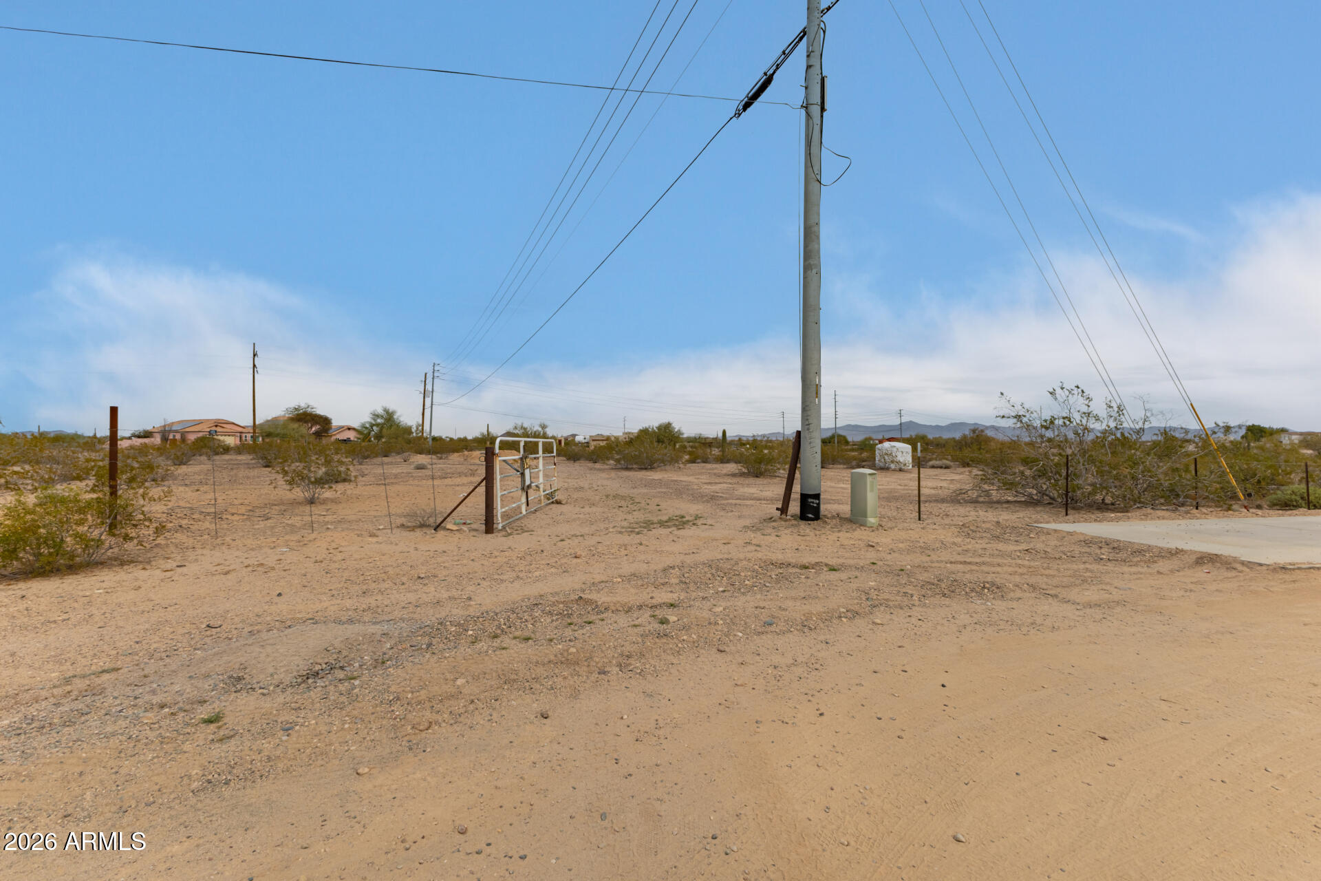 Best area in Tonopah to build your dream home. Experience each and every day breathtaking desert sunrise & sunset along w/amazing mountain views . This property's elevation is just perfect for all the beautiful desert plants and saguaro cacti. Convenient access to the I-10 FWY. Property has frontage along Tonopah-Salome Hwy. Property starts where 339th ends and Tonopah-Salome HWY/Indian School meet on left side after making a right. Permitted fence around the entire 7.05 AC w/2 access gates into the property on Tonopah-Salome HWY. 1600 gallon water tank on the property just for the landscaping drip system to provide adequate water to all vegetation on the land. Electricity on property. Zone R-43 43,000 SQFT minimum. Tons of Potential. Custom homes and ranches near by.