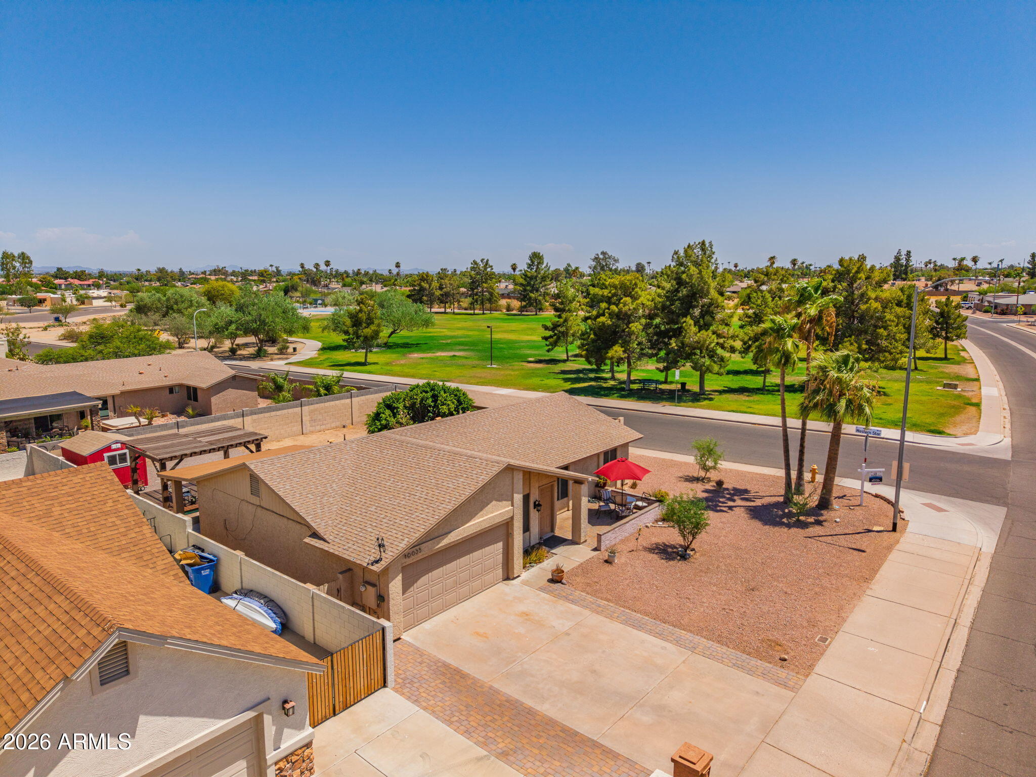 This true single story welcomes you with a front patio  overlooking the green grass of Western Star Park and the panoramas of South Mountain. You'll always have a sunset to relax to. The front driveway has added pavers making it 25 feet wide. Plenty of flat parking! Outback you'll be in a hobbyist's paradise where there's not 1 Tuff shed, but 2 (10 x 19 and 8 x 10). So much storage space! With no HOA and an RV gate this backyard is recreation ready. If you love nature you are right around the corner from 16,000 acre South Mountain Park. Hike, bike or run over 150 miles of trails(once it's not so hot!) Until then, take Fido across the street to be in the shade and soft lawn. Come see why so many love living nestled in this enclave of the great outdoors.