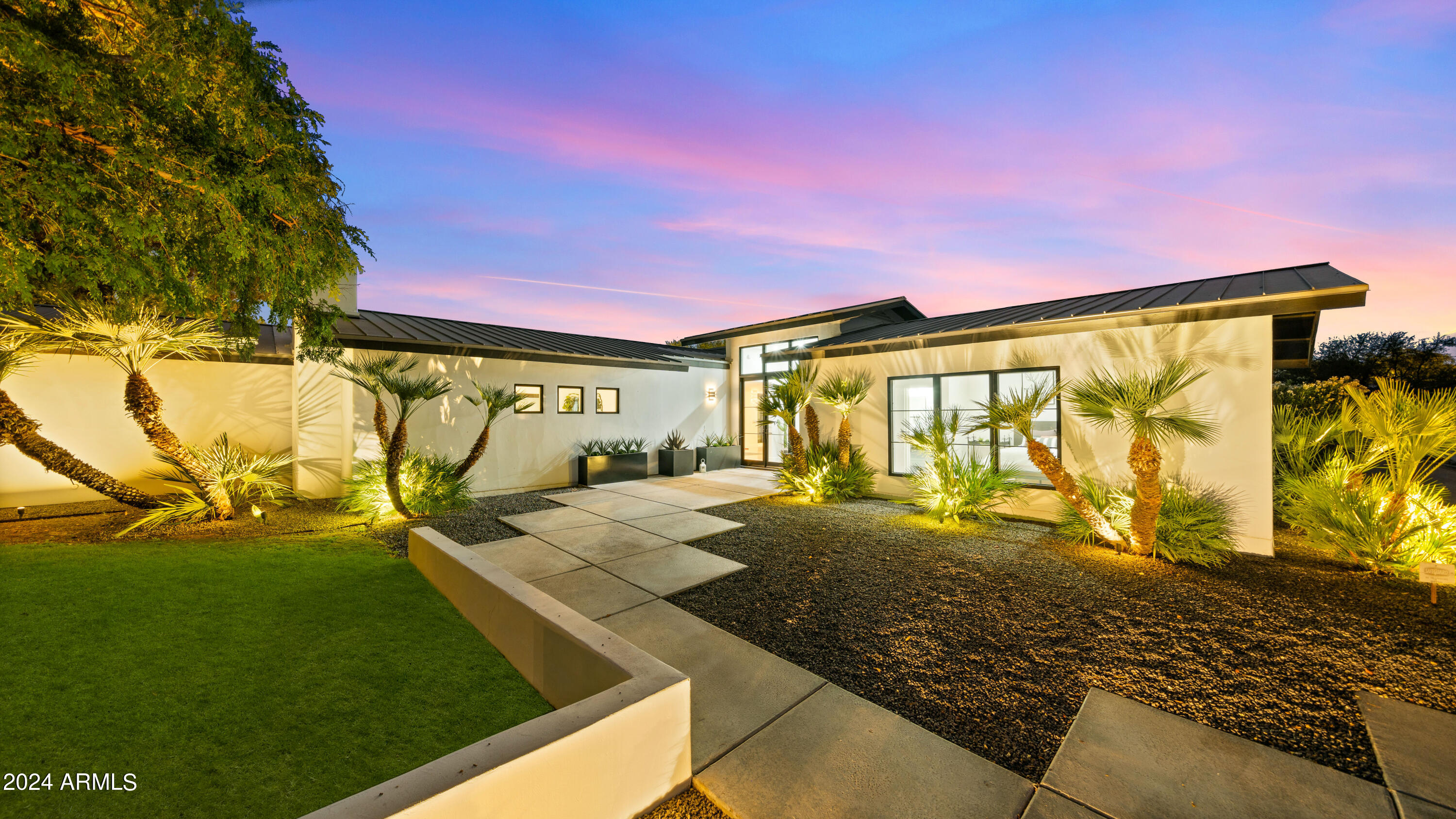 Located on a quiet cul-de-sac in the vibrant heart of Old Town, this exquisite residence offers a thoughtfully designed open floor plan that masterfully blends indoor comforts with outdoor delights. The expansive primary suite is designed as a private retreat, featuring a cozy fireplace and a separate sitting area. The chef-inspired kitchen is a highlight, centered around a striking cascading island and outfitted with stainless steel appliances, well equipped for both intimate family dinners and large gatherings.The dining space accommodates up to 12 guests and flows beautifully into a spectacular backyard through massive 20-foot pocket doors. This outdoor paradise boasts a putting green, several inviting fireplaces, a pergola and a swimming pool, creating a perfect setting for -- entertaining or relaxation. Further enhancing this home's appeal is the extensive 4-car garage along with an RV pad, offering plentiful space for parking and additional storage. This property stands as a beacon of sophisticated and elegant living within Old Town, with easy access to Sky Harbor Int'l Airport, Fashion Square mall, dining, golf courses, major freeways & much more!