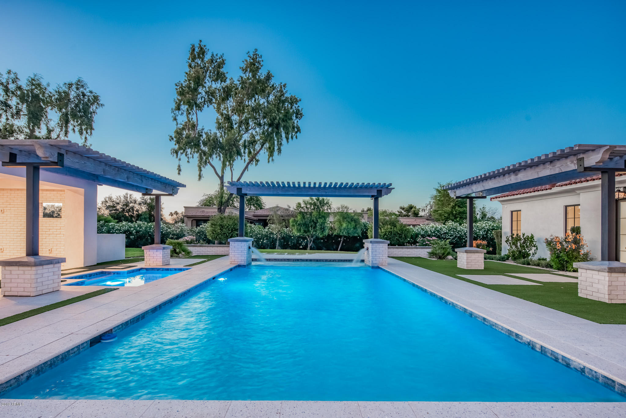 Built with a level of quality and attention to detail rarely seen, this gorgeous Santa Barbara style home with a modern, transitional feel, rests on over an acre in one of Paradise Valley's most desirable enclaves. THE ''ultimate entertainer'' designed with family in mind has jaw dropping Mummy Mountain Views, an ideal North/South orientation and is positioned in a quiet neighborhood within the desirable Three C's school district. Open plan living, resort backyard and detached guest house are just some of highlights. The property features unparalleled options for indoor/outdoor living including: private master patio and sitting areas, gorgeous pool and spa, dual grilling stations, fire pit, Ramada and custom designed landscape by Greenart Landscape.
