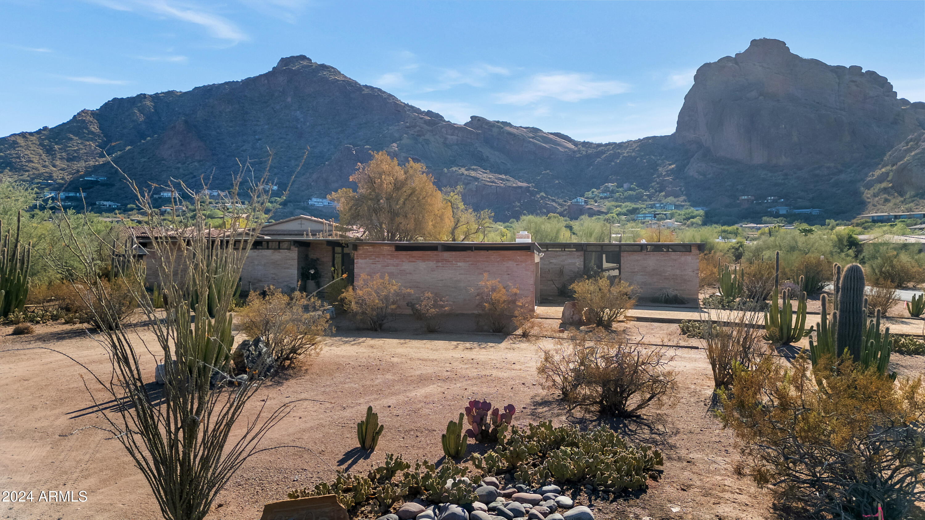 Prepare to be captivated by this extraordinary 1.45-acre lot—a rare opportunity to build your dream home in one of the most desirable locations! With sweeping, unobstructed views of the iconic Camelback Mountain from every angle of the property, this setting promises an unmatched backdrop of natural beauty. The existing home offers 3 bedrooms, 2 bathrooms, a cozy Arizona room, and a two-car garage—perfect for those envisioning a renovation or a completely custom build. Nestled in a prime location with easy access to utilities, this property is ready to transform into the ultimate retreat. Don't miss this rare opportunity to own a slice of paradise where every sunrise and sunset paints Camelback Mountain in all its glory.