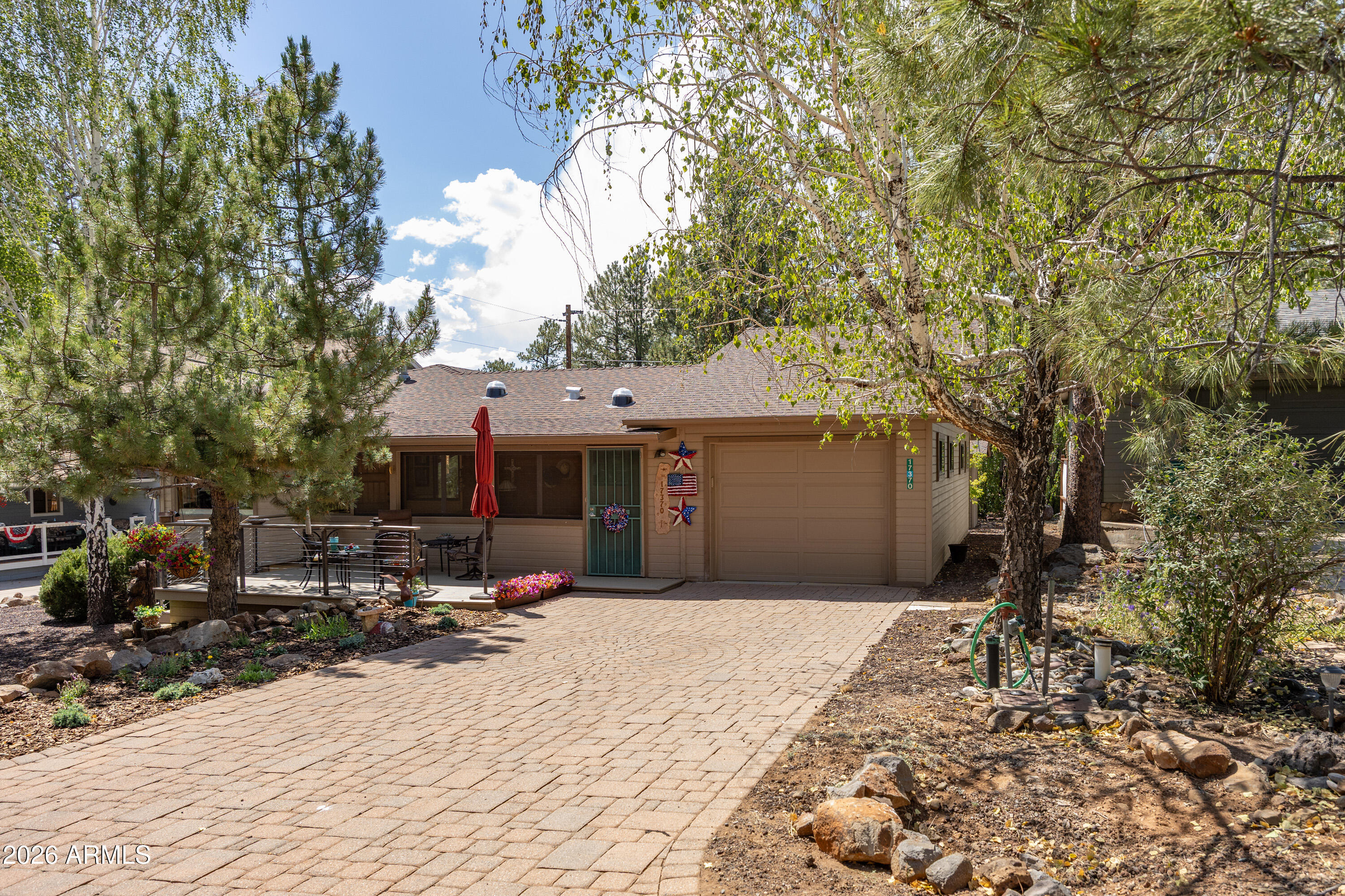 Turn-key, furnished, and ready to move into this enchanting single-level home.  Rustic, modern, and fully updated. Sunroom as you enter the home, plus three bedrooms, 2 1/2 baths, and a bonus room. One-car garage, parking for multiple cars & an RV. Oversized paver driveway, 9x12 storage room. Storage building in the back, plus a large deck to enjoy outdoor living. A brochure is available for additional information on this one-of-a-kind home.