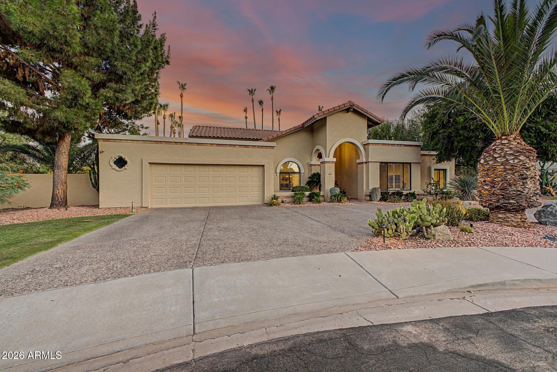 Terrific remodeled home in Andalusia One on a private & larger lot (18,039 square ft) that sides to a landscaped wash! 3 bedrooms & 3 FULL baths. Two Master bedrooms are split from each other & the third bedroom (15 x 12) could be an ideal den, office, or zen room. The open floor plan features an oversized great room with soaring vaulted ceilings, an amazing surround sound system, a formal dining area, and a wet bar!...Awesome for entertaining ! Quartz counter tops in a light and bright Chef's Eat In island kitchen with lots of counters & cabinets & a breakfast room overlooking a sparkling pool. Two fireplaces, plantation shutters throughout, freshly painted interior in May of 2026, epoxied floor in garage, neat and clean and well cared for. Quiet backyard & firepit.....A spectacular home