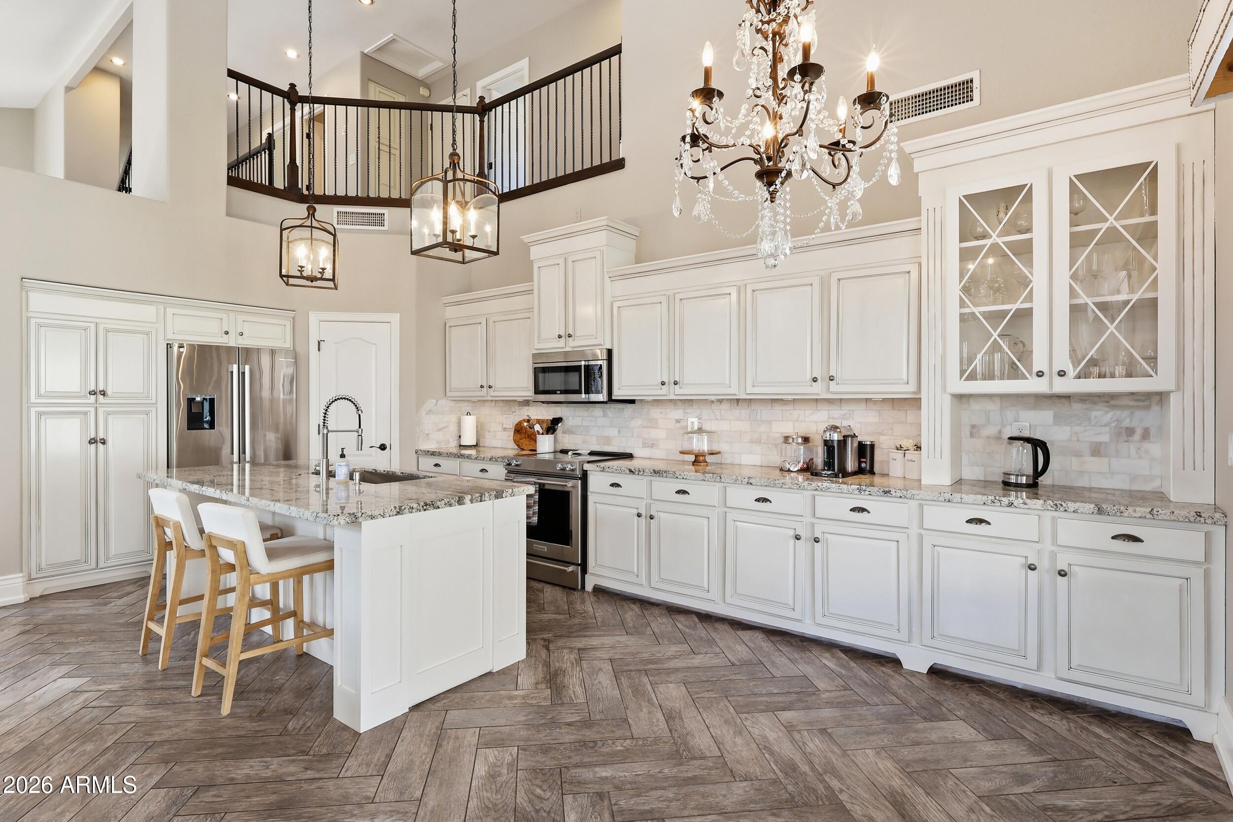 Gorgeous 5-bed, 2.5 bath home on a premium corner lot with mountain. Large open concept kitchen with vaulted ceilings filled with natural sunlight, herringbone tile & designer touches. Gourmet kitchen, granite countertops, marble backsplash, custom cabinets, and Bosch fridge/dishwasher, Retreat to main-level primary suite with freestanding spa-like bath, custom walk-in closet. NEW HVAC in 2025. Mountain views from every upper-level bedroom. Freshly landscaped backyard with turf and pavers...looks beautiful