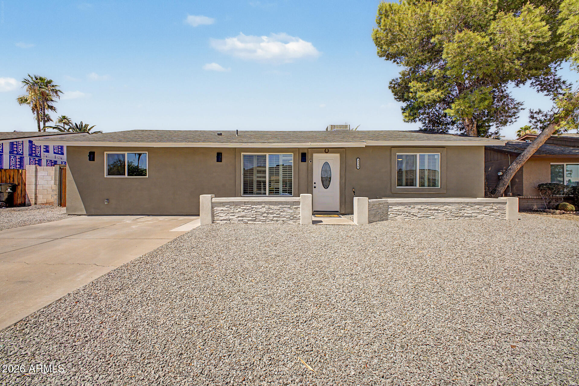 Home, sweet home! This total remodel 3-bedroom, 2-bath property showcases a convenient RV gate, stone accents, and a low-maintenance front yard. Inside, you'll find a cozy living room with a soothing palette, classic plantation shutters, and stylish wood-look flooring. The eat-in kitchen comes with granite counters, white shaker cabinets with crown moulding, contemporary track lighting, and sleek stainless steel appliances for a seamless culinary experience. All bedrooms are well-sized, providing a private retreat for a good night's sleep. Enjoy quiet afternoons in the backyard, which offers a covered patio, lush natural turf, and abundant space for outdoor relaxation. Don't miss out on this fantastic opportunity! Most important...no HOA. Bring all your toys!!