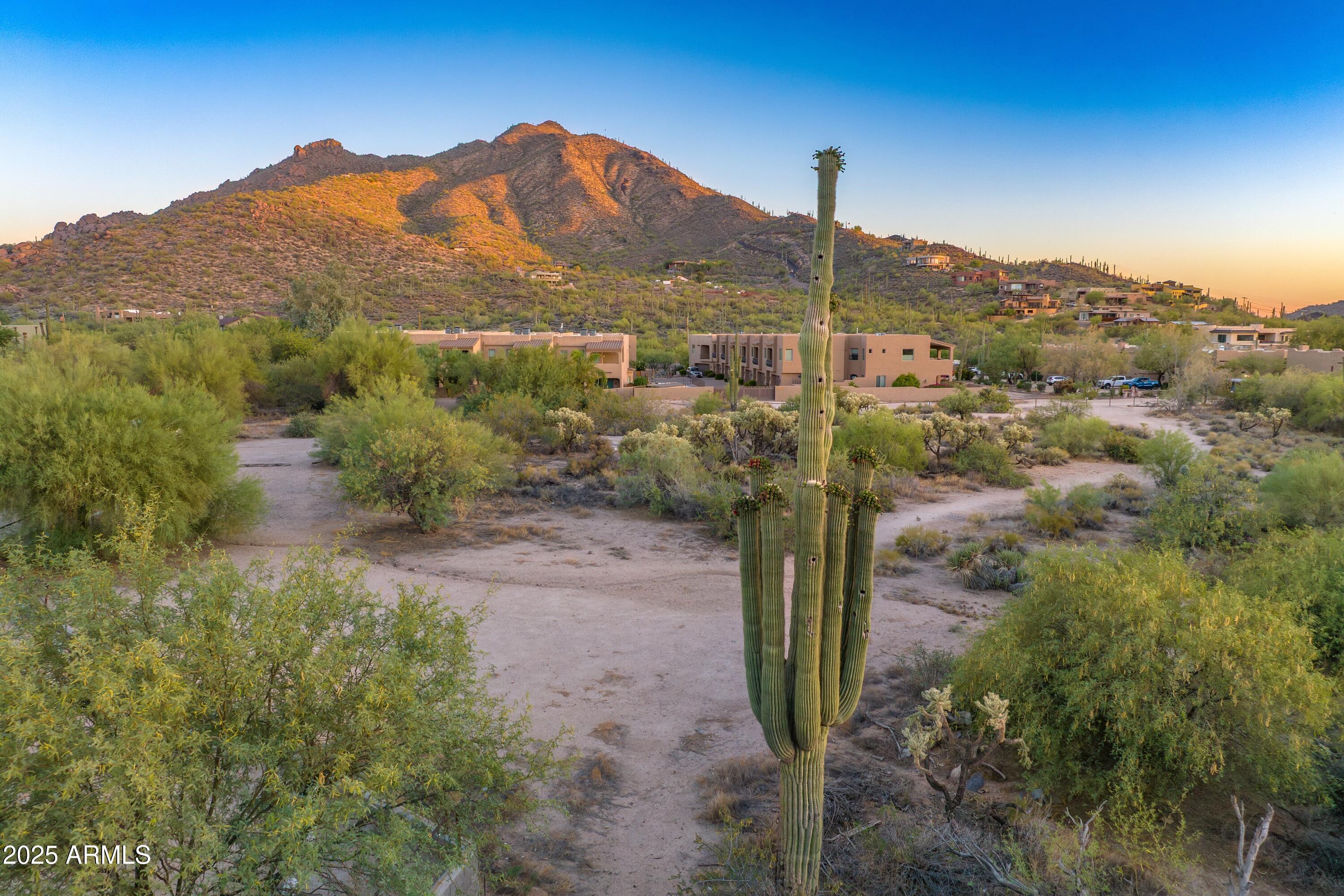 Right in the center of the eclectic town of Cave Creek!  Street frontage on Cave Creek Rd and School House Rd.  Black Mountain majestically rests in the background.  Great exposure.  Walking distance to many restaurants and shops.  5.2 acres.