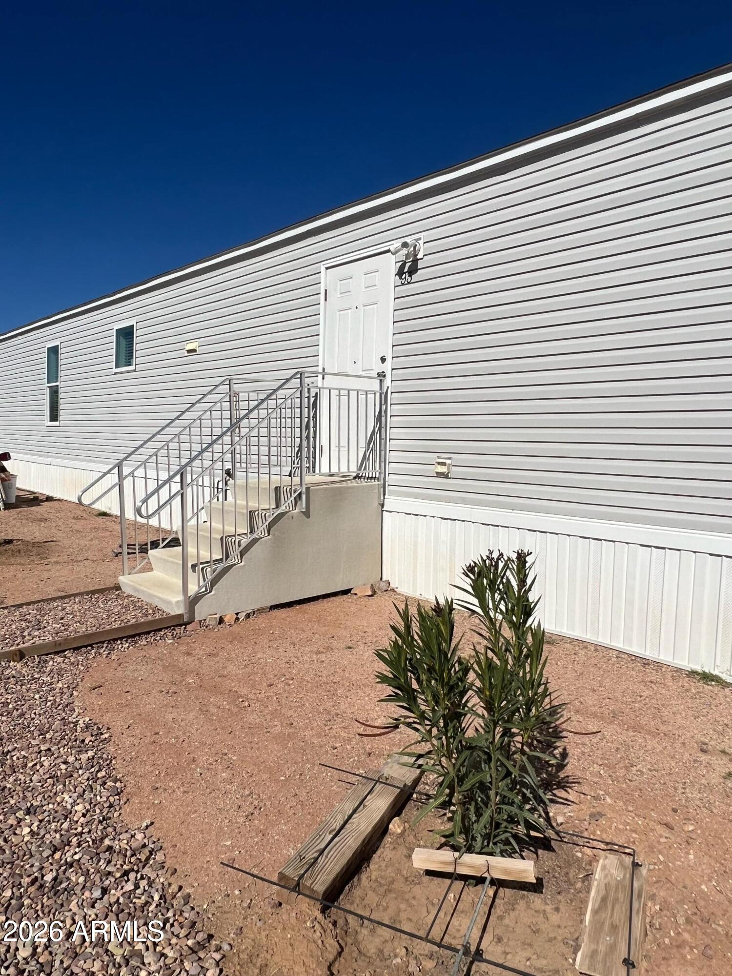 Discover the perfect blend of space, serenity, and convenience at 93 E Via Guasave in Huachuca City, AZ. This nearly half-acre parcel offers breathtaking mountain views in a quiet, peaceful setting, ideal for those seeking a getaway or a smart investment opportunity. Enjoy the feeling of being tucked away, yet just minutes from town amenities. Motivated seller, submit all offers! Don't miss your chance to own a slice of Southern Arizona beauty.