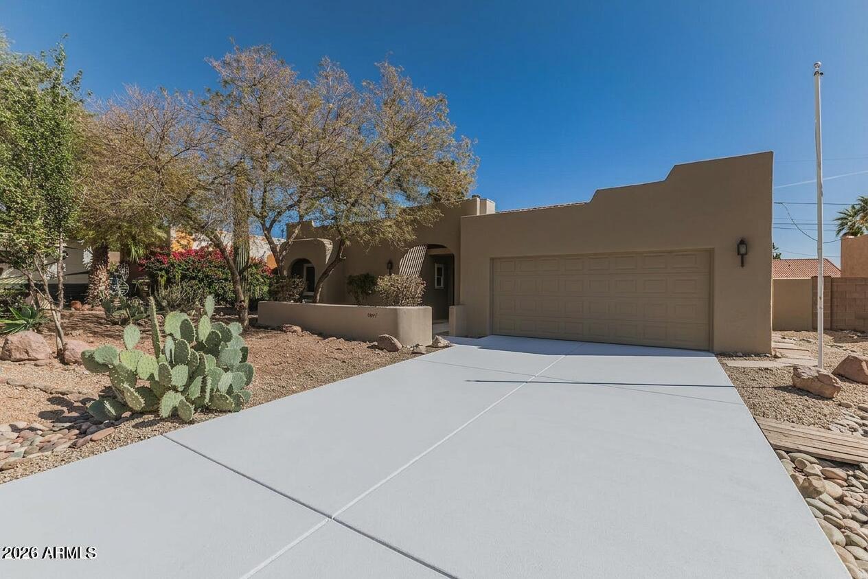 Nestled in the scenic beauty of Gold Canyon, this charming and fully remodeled 3-bedroom, 2-bath home offers 1,622 sq ft of comfortable living space with a desirable split floor plan. All new LVP flooring throughout, quartz countertops, refinished cabinets, all new paint inside and outside and all new fixtures throughout the home. The spacious primary suite features a custom tiled shower and walk-in closet, while the open living areas provide plenty of room for relaxing or entertaining. Enjoy Arizona living with a welcoming front courtyard perfect for morning coffee. The home also includes a cozy Arizona room, low-maintenance desert landscaping, and a 2-car garage. No HOA!  Located near hiking and biking trails, lakes, and world-class Gold Canyon Golf Course and spa.