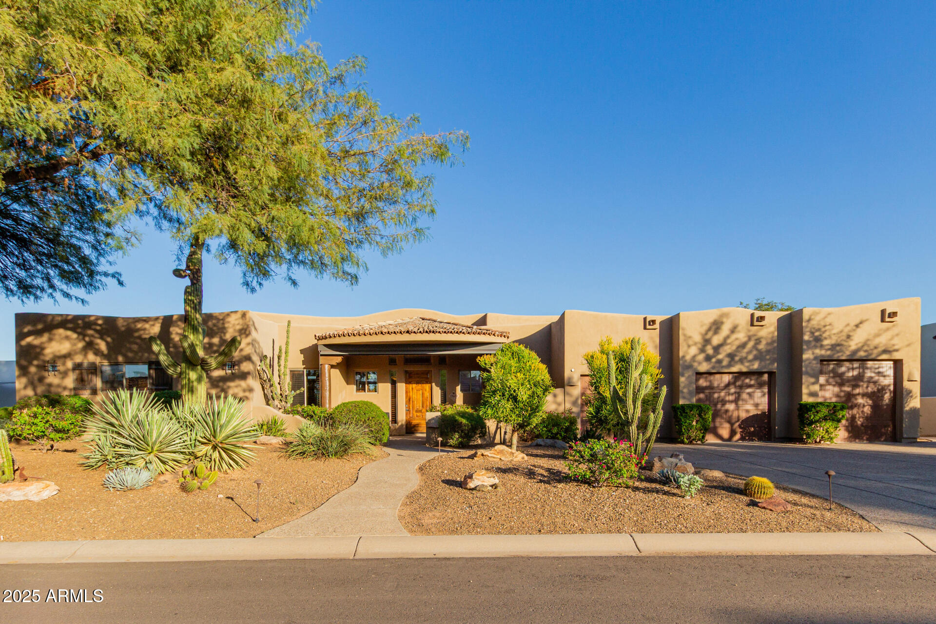 Looking for the million dollar view in Tonto Verde?  This almost 4200 square foot home, located on the 4th green of the Ranch Course, features  spectacular mountain and golf course views from almost every room in the house. Showcasing great curb appeal, manicured desert landscaping, climate controlled 3-car garage with storage cabinets & storage room.  The  welcoming front porch is protected by an automatic sunscreen.  As you enter the front foyer, you can see the McDowell Mountains, the desert, and the 4th green. Inside you will find an open floor plan that has a spacious formal dining room with a see-through gas fireplace between the dining room and the breakfast nook with butted glass for unobstructed mountain & golf course views. The kitchen/great room features dramatic granite counters, custom tile backsplash, KitchenAid black stainless steel appliances, coffee counter, quiet close cabinets with hardware, huge island, convection cooktop, Travertine floors & baseboards, 12 ft.high cove ceilings, recessed lighting, trending palette. The kitchen is open to the great room with its wall of glass to the East end, to take advantage of those mountain views. The great room also features an elegant wet bar, with wine cooler, and access to the huge covered patio.  In addition, there are His and Her offices, with double french doors & custom cabinetry.  . Primary suite showcases stylish wood floors, remote controlled Hunter Douglas shades, access to to the hot tub just steps away, walk in closet, and a lavish ensuite bath w/dual sinks, dramatic granite counters, heated floors tile, heater in the ceiling, soaking tub, huge walk in shower with very stylish tile, and water closet with Toto washlet toilet & bidet. Two ensuite guest rooms with newer quartz counters, stylish tile showers & Toto washlet toilets. The third ensuite has a walkin closet and a private exterior door, so it is an attached Casita. The house is sited on the property so that the views from the Primary Bedroom, dining room, breakfast nook, kitchen and the greatroom are spectacular. Lastly, the wonderful backyard includes a huge covered patio and extended seating area overlooking the Community's lush golf course! In wall pest control for carefree living and solid wood doors.
What are you waiting for? 3 charming flagstone patios overlook the Bocce court with golf and mountain views.  Act now!
