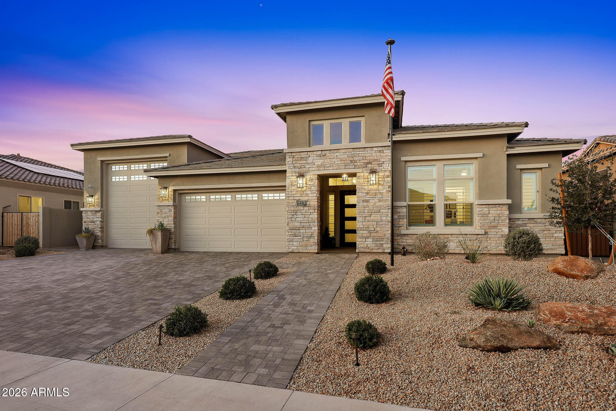 Impeccably upgraded David Weekley home featuring an RV garage and a resort-style backyard, thoughtfully designed and meticulously maintained to reflect true pride of ownership. The heart of the home is the gourmet kitchen, showcasing a stunning waterfall-edge island, professional-grade Monogram appliances, double wall ovens, pot filler, and a built-in Thermador wine refrigerator, ideal for both everyday living and entertaining. The luxurious primary suite offers soaring 12-foot ceilings, an expansive walk-in shower with multi-shower heads including rain head, and an oversized walk-in closet, creating a serene private retreat. Wood-look tile in an elegant herringbone pattern flows throughout the home, adding warmth and timeless style. Additional living spaces include a private guest suite with ensuite bath and kitchenette, two secondary bedrooms connected by a Jack-and-Jill bathroom, and a dedicated office or den. The oversized three-car tandem garage and impressive 50-foot RV garage with epoxy floors are true standout features, offering exceptional storage and flexibility. Outdoor living is elevated with a sunken fire pit, above-ground spa, custom cantilever shade structure, travertine hardscape, and permanent holiday lighting - perfect for year-round enjoyment. Schedule your private tour today and discover the best Canyon Views has to offer.