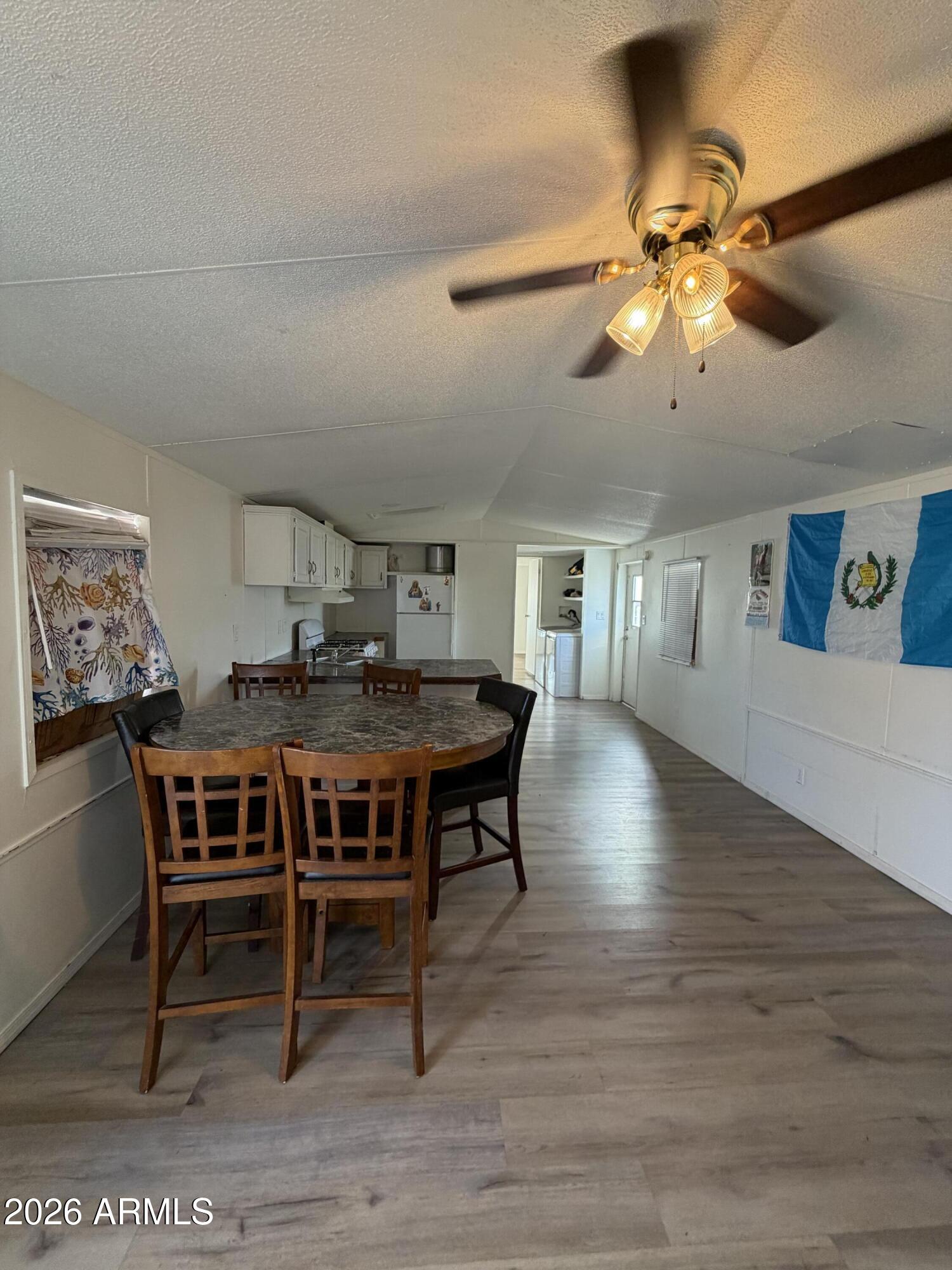 Well-maintained 1994 manufactured home offering 1,200 sq ft of comfortable living space. This home features 3 bedrooms, 2 full bathrooms, and a functional open floor plan designed for everyday living. The spacious primary suite includes a private bathroom, while the additional bedrooms provide flexibility for family, guests, or a home office. The kitchen offers ample cabinet and counter space and opens to the dining and living areas. Outside, enjoy covered parking with space for up to 3 vehicles. Conveniently located near shopping, dining, schools, and major freeways. An excellent opportunity for affordable homeownership. Buyer to verify all facts, figures, and measurements.