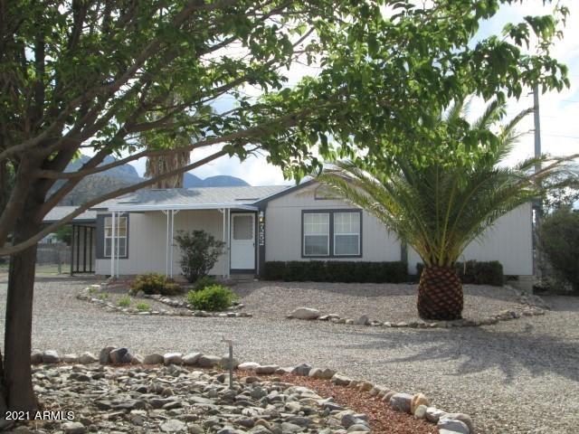 Enjoy a gentle, cool breeze on the back covered patio while watching the clouds roll in over the Huachuca Mountains. Located on almost 1/2 acre, this well maintained 3 bedroom/2 bath home boasts a split floorplan with a large master suite that includes double sinks, a garden tub and separate shower. The efficient, well-appointed kitchen has plenty of cabinet space to store those extra cooking supplies. The refrigerator, washer and dryer are ready for the new owner to use! Easy access to Sierra Vista, Fort Huachuca and Bisbee. Call for a private showing today!