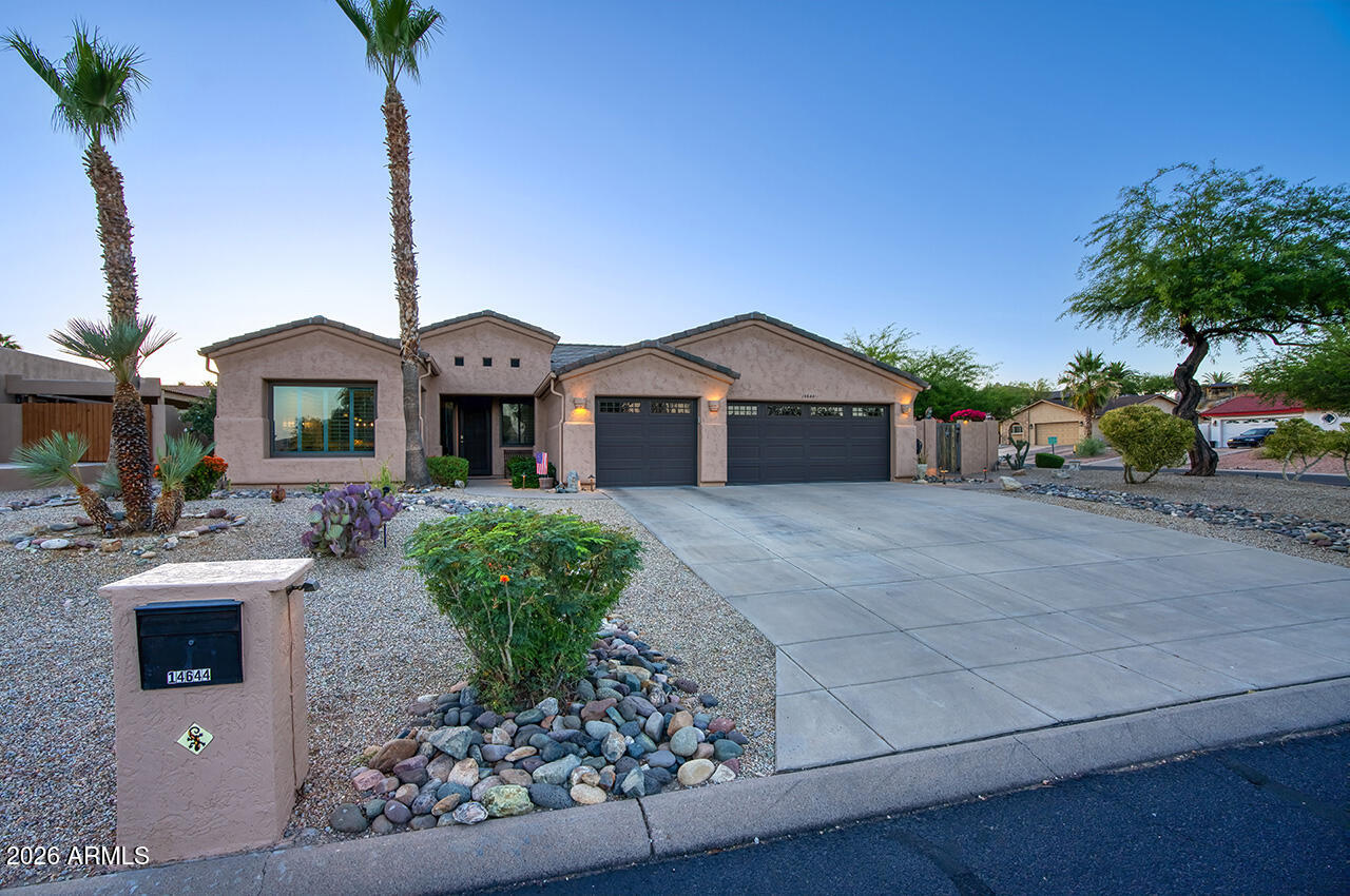 Experience true pride of ownership in this impeccably maintained, move-in ready home. Immaculately clean and beautifully upgraded, this open-concept floor plan features a remodeled kitchen with soft-close cabinetry, Bosch dishwasher, new stove, Andersen windows and doors, plantation shutters, wood-burning fireplace, and remodeled primary bath. Major upgrades include a newer roof, newer garage doors, fresh exterior paint, updated PVC irrigation, and both AC units replaced within the last year. Enjoy a backyard oasis with a low-maintenance saltwater pool, sunken fire pit, outdoor TV, electric patio shades, raised garden bed, citrus trees, RV gate, and stunning LED landscape lighting.