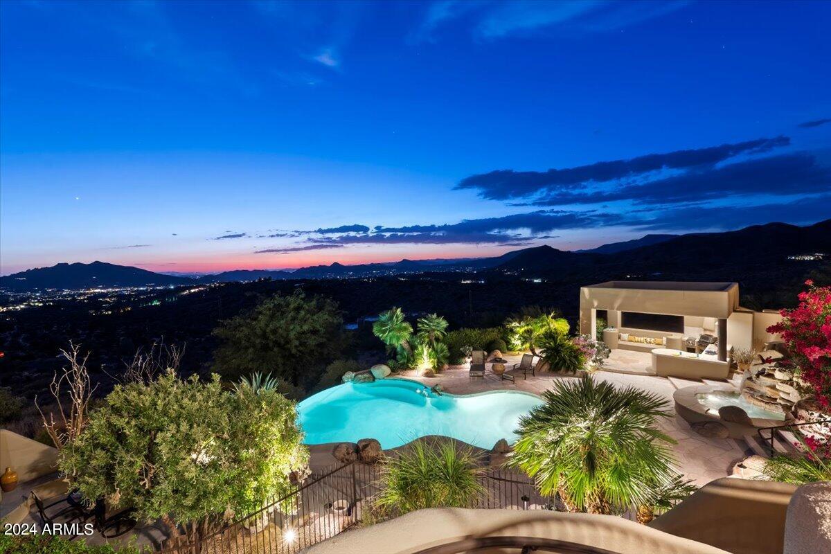 OWN THE MOUNTAIN! Live the Dream in your North Scottsdale Mountain guard-gated 6931 SF Estate! Infused with extraordinary 360 degree VIEWS, savor momentous beauty on your PRIVATE 5-Acre Mountaintop perch. With every amenity at your command welcome family & guests into your 3 Separate Guest Houses, accessible to main home via elevator. Visit and you will be forever transformed. Remodeled luxury. Sonoran charm. Elegant & practical, house numerous cars and hobbies...entertain or retreat at this Sonoran Mountain ''Carefree Ranch'' compound.  Arrange your Tour today, to view 6BRs, 6.5BAs, 3 SEPARATE Guest Houses w/ kitchens & living areas, elevator, multiple patios, and forever views... North Scottsdale beckons, your new home awaits....For remodeling & amenity details, please CLICK ''MORE''... The main floor features a grand primary suite and Retreat, guest suite, and phenomenal office, while an elevator leads to additional guest suites below, ensuring comfort and accessibility for all. The formal dining room, complete with access to a wet bar, is ideal for hosting elegant dinners, while the living and family rooms provide....ample space for relaxation and gatherings. The gourmet kitchen flows seamlessly into the family room, opening to a spacious deck that frames the panoramic valley views, perfect for morning coffee or sunset cocktails. The master suite is a retreat unto itself, featuring a cozy fireplace, private deck, and an extra room for exercise equipment or additional storage. Outside, discover a resort-style pool area, complete with a poolside Ramada, BBQ, outdoor shower, and fireplace, setting the stage for Arizona's quintessential outdoor living. Whether it's lounging by the pool or dining al fresco under the stars, this property offers the ultimate desert lifestyle.

A. Exterior
a. Elastomeric sealer and stucco patching/finish on entire exterior of home
including landscaping walls (2021)
b. Paint on entire exterior including landscaping walls (2021)
c. New awnings (2021)
d. New European black out roll-out shutters in master bedroom (2022)
e. New foam roof in 2022
f. New exterior landscape lighting and transformers by "Let There Be Light"
g. New lighting on ceiling of upper deck
h. New heat pump for swimming pool (2022)
i. New pebble pool surface in pool, fountain, and infinity pool (2022)
j. New water line tile and wall of infinity edge of pool (2022)
k. Landscaping 2022
i. Extensive tree/ desert plants additions and removals
ii. All new gravel added to beds
iii. New drip system in entire yard
iv. New driveway boulder wall with landscape rocks lining street to
corner stop sign
l. Sound system speakers connected to Sonos house system. Speakers by pool, and
upper deck

B. Interior
a. Hardwood engineered floors in living room and primary bedroom and primary
closets (2021)
b. New water softener system commercial grade (2022)
c. New paint throughout (2021)
d. Drywall niches updated for flat screen tv (2021)
e. Surround system in master, office, living room, dining room, family room, lower
tv suite (2021)
f. TV movie surround system in family room (2021)
g. Two stackable laundry units new (2021)
h. Replaced skylight over deck entry (2022)
i. Appliances:
i. New Sub-Zero Fridge and Freezer in Kitchen (2024)
ii. New Wolf Electric Cooktop (2024)

iii. New Bosch Dishwasher (2022)
iv. New Kitchen Aid Ice Maker in Bar (2023)
j. Iron entry doors Custom built (2021)
i. Front entrance
ii. Double door casita
iii. Driveway casita
iv. Pool House Casita
k. New garage door springs and openers (2021)
l. Tesla Level 2 Hardwired Charger (2024)
m. Electrical Panel update in Pool utility room (2021)
n. Electrical Panel updates in garage panel (behind the fridge) and exterior panel by
garbage area enclosure (2023)
o. Ceiling Fan upgrade in master bedroom and deck, kitchen, laundry room, family
room, and pool house (2021)
p. New Toto (one corner toilet not Toto) toilets in every bathroom in the house
(2021)