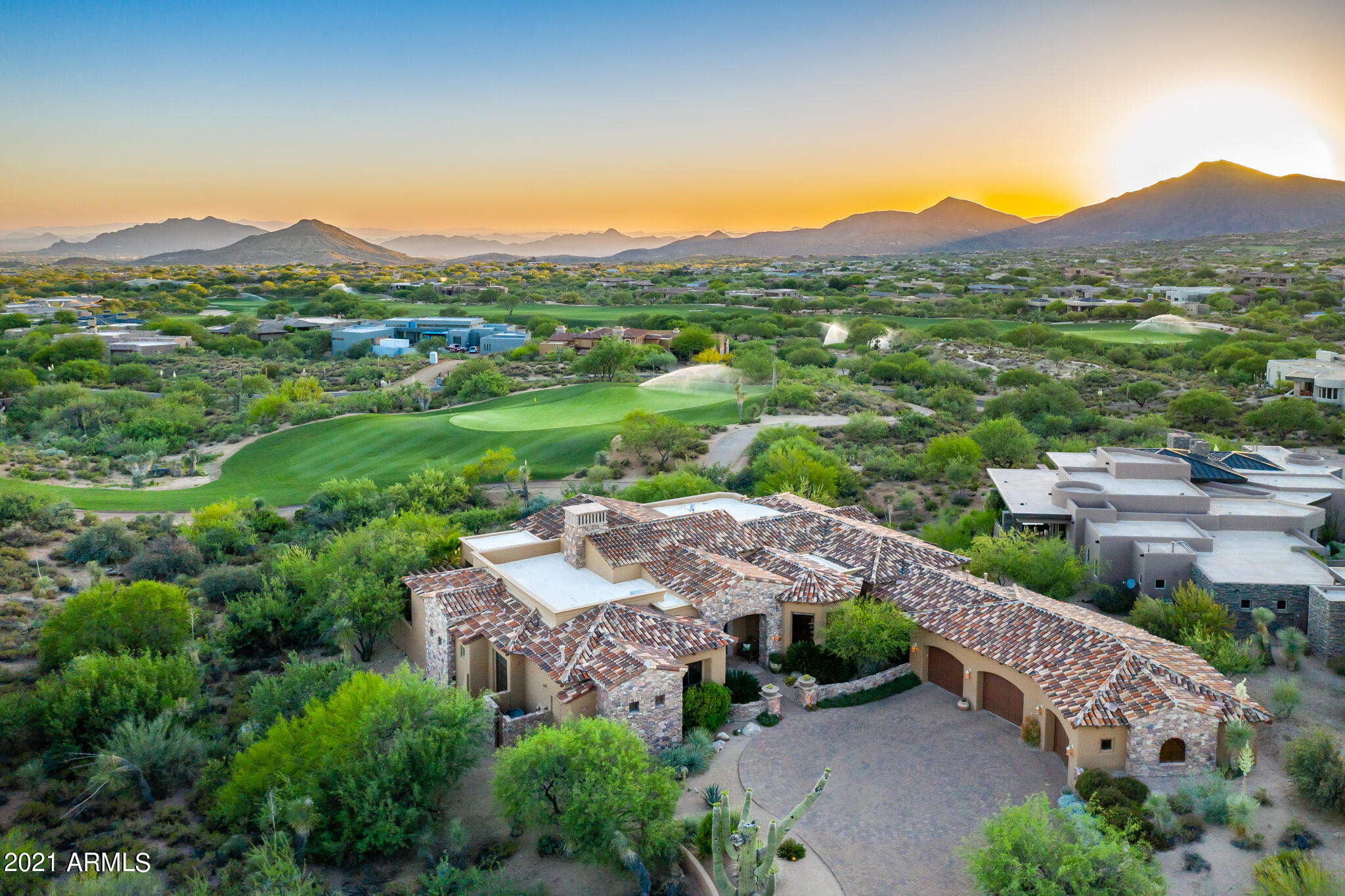 Desert Mountain beauty overlooks the Apache course with AZ mountain, sunset and city light  views!  Estate setting...quiet cul-de-sac in Painted Sky Village with private drive and lush landscaping. Sought-after single-level, Open Plan with beamed ceilings, expansive great room windows, chef's kitchen, office/library, entertainer's wine cellar and bar, and luxury master suite w his & her large closets and WC's. Three guest ensuites in separate wing. Exquisite designer details throughout. Resort patio boasts expansive covered living and dining areas, two secluded shade patios and a large sunny poolside deck that includes a fire-pit and TV area.   Generous storage throughout.  Furniture available. Golf or Lifestyle Membership to the private Desert Mountain Club available by application.
