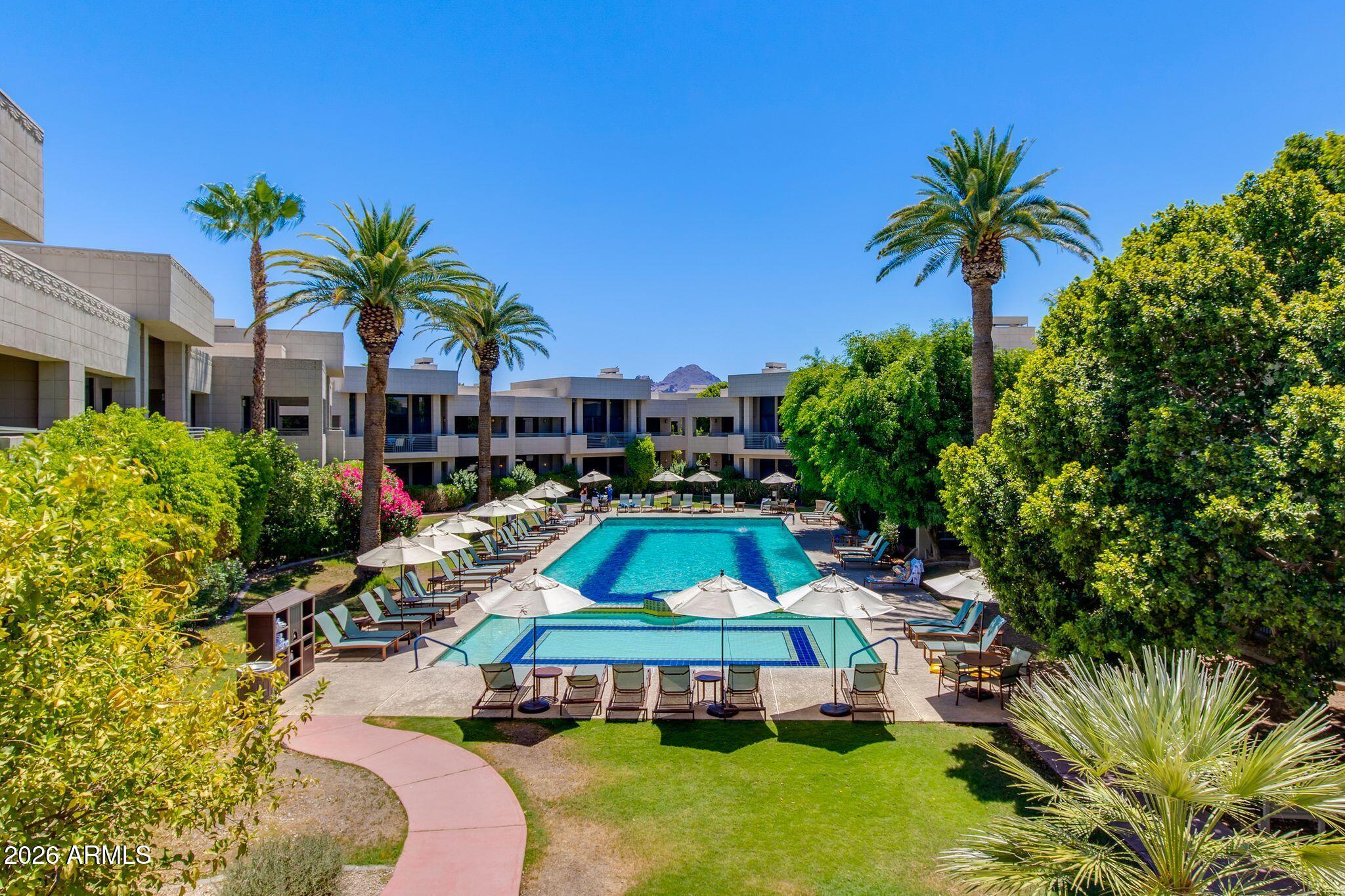 A rare opportunity to own within the iconic Arizona Biltmore Resort! Overlooking the Catalina pool, this completely renovated 2 bed, 2.5 bath villa is one of a kind. Set within a lush, resort-style environment, residents enjoy access to world-class amenities, manicured grounds, and the timeless charm of the historic Biltmore lifestyle. Inside, the residence features two primary suites and a split floor plan designed for ultimate privacy. The villa offers an open layout, a spacious kitchen with stainless steel appliances, spacious living areas, and an expansive patio. Whether you're seeking a full-time residence, a lock-and-leave seasonal retreat, or an exceptional luxury investment, this villa offers a rare blend of luxury and resort-style living in one of Arizona's most iconic addresses.