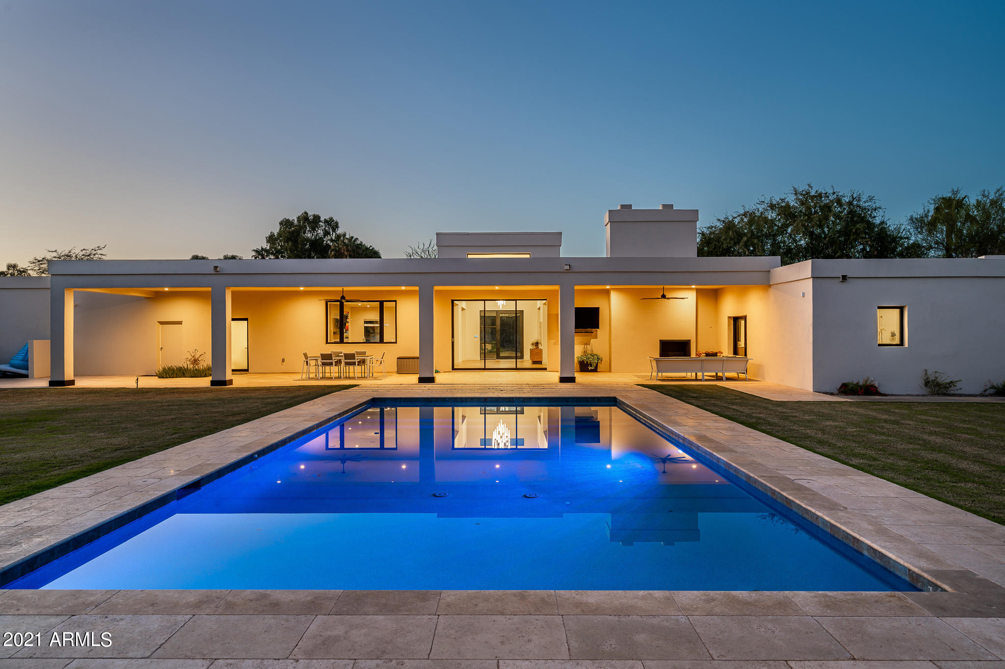 Modern home with Mummy Mountain Views in the heart of Paradise Valley. Enter this completely transformed property with a world class design, light & bright, open floor plan, top of the line finishes incl. Wolf/Sub Zero appliances; complete with an  amazing indoor/outdoor feel. Retractable Fleetwood glass wall opens to an over-sized covered patio and expansive yard, which includes a large pool, walking paths, and sport court. The master retreat includes a sitting area off the patio with exterior fireplace, spacious walk-in closets & modern master bath with large walk-in shower and free-standing tub. Come tour this stunning 4 Bedroom all ensuites, 5.5 Bath home, complete with an office and flex space in the highly desirable 3 C's School District!