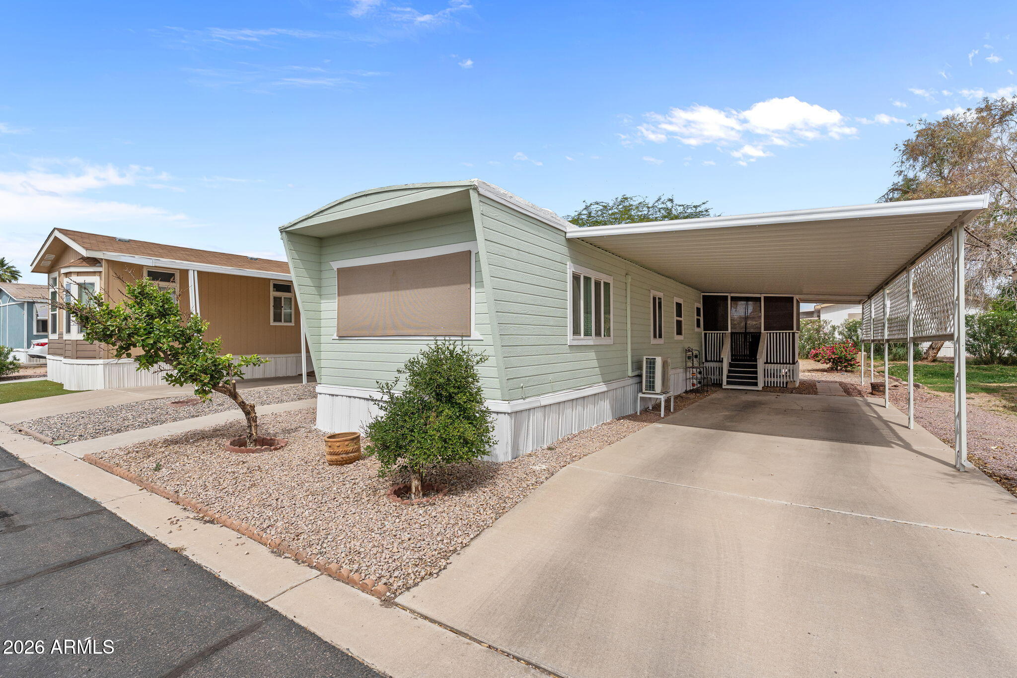 FINANCING AVAILABLE! Welcome to this beautifully updated and exceptionally well-maintained 2-bedroom, 1-bath manufactured home in Litchfield Village! From top to bottom, this charming home has been thoughtfully upgraded, offering modern comfort and peace of mind. Major improvements include roof resurfacing in 2022, brand-new mini split systems installed in 2025, updated plumbing in 2025, and a fully remodeled kitchen and bathroom completed in 2026. New dual pane windows were installed in 2026. Interior and exterior of the home was freshly painted in 2026. Kitchen electrical was also updated and a new breaker box installed. The stunning kitchen features granite countertops, a stylish tile backsplash, and stainless-steel appliances, creating the perfect space for cooking and entertaining. The bathroom has also been tastefully remodeled with contemporary finishes including a Quartz countertop and linen closet. Enjoy outdoor living year-round in the screened-in patio, along with low-maintenance landscaping, a spacious 2-car carport, and additional storage space. Litchfield Village offers fantastic community amenities including a swimming pool, dog park, walking paths, and a clubhouse complete with billiards, a kitchen, and fitness facility. Lot fees conveniently include street and common area maintenance, sewer, and garbage services. This move-in-ready home combines charm, updates, and community living all in one package!