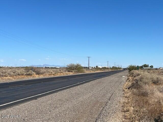 Fantastic investment opportunity with paved road access. Beautiful panoramic view. Very few neighbors. Great location for a custom or manufactured home. Located near I-10 and the masterplan community Belmont. No HOA and plenty of room for Horses, Toys & RV parking. Additional Maricopa County parcel # 506-44-108K. Property tax are for both parcels.
