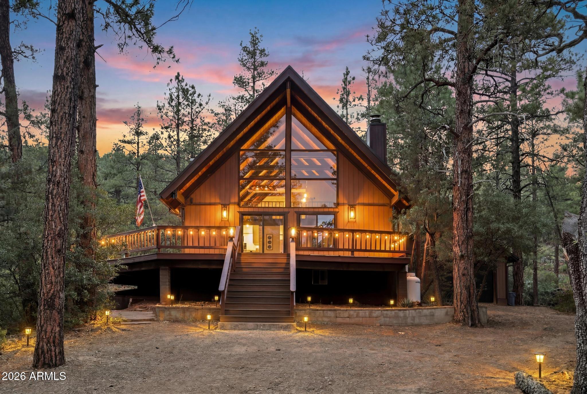 A-Frame tucked in the ponderosa pines with panoramic views & backed up to the national forest.  REMODELED top to bottom, including plumbing, electrical, roof, windows, deck, floors, full kitchen/baths, paint, all fixtures & all new appliances, including washer/dryer.  Two story stone, wood burning, fireplace & additional wood burning stove and tongue & groove wood ceiling with beams. 2 story with 2 bedrooms & bath on first floor & a loft/pool table, bedroom & full bath on second floor.  Oversized trex decking with tons of space for outdoor living. 2 car detached garage with tons of room for all the toys. 4 minutes from center of Strawberry & 5 minutes to Pine. Easy access to everything and a quiet area. Only 2 hours from Phoenix, Flagstaff & 1 hour from Sedona. Hiking, shopping & food.