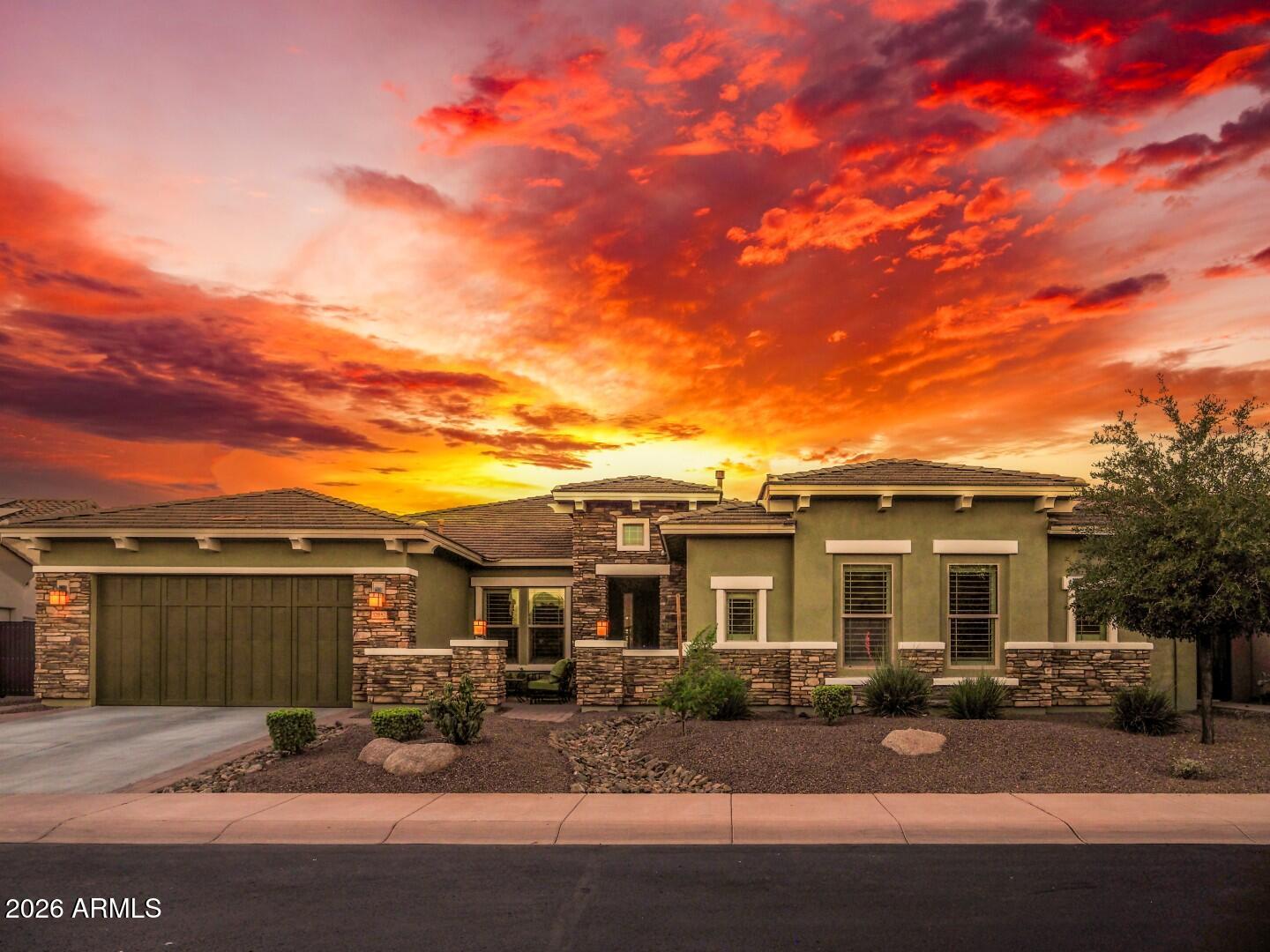 Assumable VA loan at just 2.375% is available to qualified buyers (not just veterans), offering potential savings of more than $1,200 per month compared to current market rates. Experience elevated desert luxury in the prestigious guard-gated community of Blackstone at Vistancia. Perfectly positioned North/South on a quiet street, this property combines luxury craftsmanship with outstanding energy efficiency. Designed with both comfort and entertaining in mind, the expansive open-concept floor plan showcases a stunning 16-foot sliding glass patio door for ideal inside/outside living. Thoughtfully designed for privacy and functionality, the home features four spacious bedrooms, each with its own private ensuite bathroom. The luxurious primary suite serves as a true retreat. In addition to the bedrooms, the home offers a large bonus room ideal for a media room, game room, fitness space, or secondary living area. A dedicated office provides the perfect work-from-home setup and could easily be transformed into a 5th bedroom if desired. The oversized pool anchors a backyard designed for entertaining and relaxation, featuring a built-in hot tub, gas fire pit, outdoor kitchen, and two rock waterfalls that create the perfect resort ambiance. Car enthusiasts and storage lovers will appreciate the oversized 4-car garage featuring polyaspartic-coated floors, full insulation, and mini-split A/C system for year-round comfort. With ample room for vehicles, toys, golf carts, and workshop space, the garage is as functional as it is impressive. Located within the exclusive Blackstone at Vistancia golf community, residents enjoy privacy, stunning mountain scenery, walking paths, and access to one of the Valley's premier luxury neighborhoods.