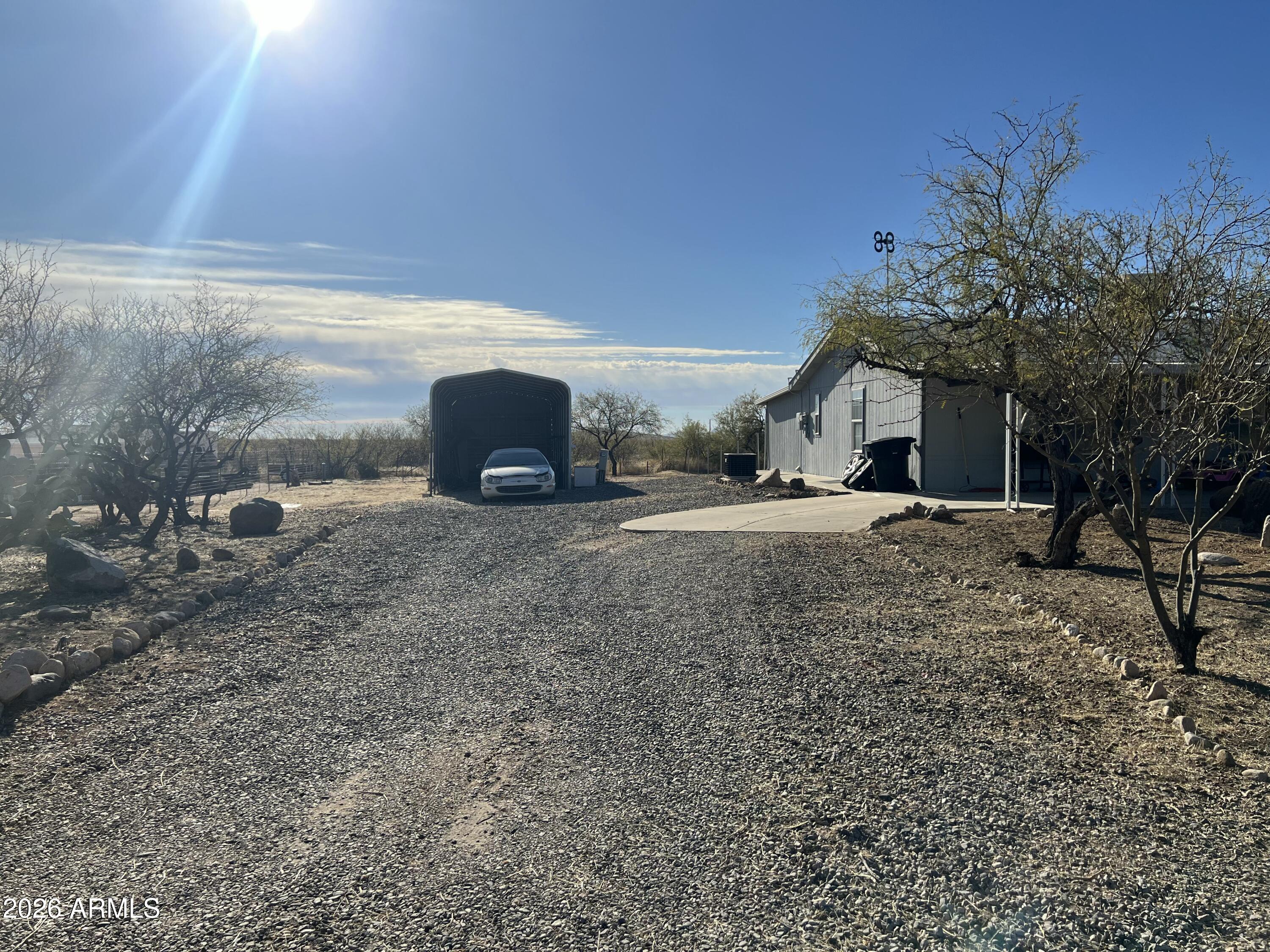 Absolutely great opportunity to own this 3 bedroom 2 bathroom home, near local SR71. Property walking distance to town offers an array of features: RV Carport w/ RV Hook up, 30x12 heated & cooled Arizona room. Spacious backyard, great spot for a garden and cultivate. Fantastic split floor plan with wood like vinyl flooring in living room and dining area. Large master bedroom w/ walk-in closet and adjacent full master bathroom. Nicely sized bedrooms, great for family or guests alike. Spacious light filled kitchen with a lot of oak cabinets and counter spacing. AZ Room makes a great extension to the home. Nearly 1/2 acre lot on a circular driveway! Come see this gem of a property
