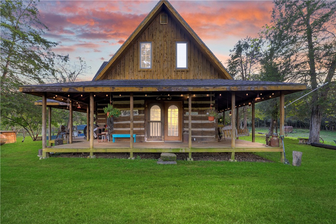 This slice of paradise is in a very private setting on nearly 68 acres, with both pasture & hardwoods to enjoy all to yourself... & your farm animals too! Only 18 minutes from the Huntsville Harps for necessities & a very easy drive on only about 6 minutes of gravel country road. When pulling up to your private oasis, you'll cross the creek that is located on your property. The cabin has 2 bedrooms & 2 bathrooms, well water & a Culligan system for drinking water! This cabin was built with 2x6 exterior walls so you’re going to love its solid structure and the fact that it stays pretty cool without having to use the AC. If power is out, no worries! The fireplace heats the house well during the winter! Although this place needs some TLC, it is a great opportunity to own a solid home on beautiful land and have plenty of privacy. Please ask for the video tour and drone footage!