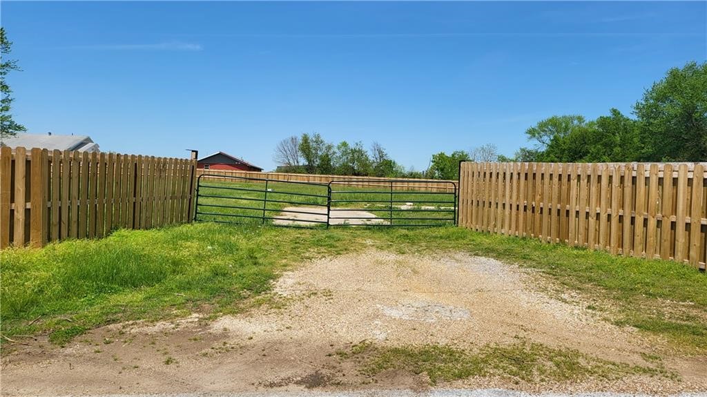 Great opportunity! 1.44 Acres on a prime location. Lots of potential! Zoned Commercial I-1 (Light Industrial), Ideal for multi-family development in one of Northwest Arkansas’ most dynamic growth corridors. Strategically located within a federally designated Opportunity Zone, this parcel MAY also qualify for inclusion in the innovative S.E.E.D. District—unlocking further possibilities for value, Positioned just minutes from the rapidly expanding downtown Springdale district walking distance from corner of HWY 412(W. Robinson)/Powell in Springdale. Centrally situated near 71B/S Thompson St.  Wood Fenced all around for more privacy. Existing well on property but water on street. New septic system installed in 2017. for a Buyer needing to built a home with acreage or park heavy equipment  and storage or commercial use! Schedule your showing today to appreciate this private 1.44 acres before it's SOLD! Se habla Español!