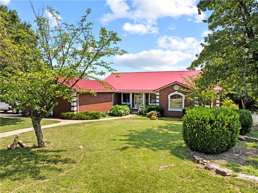 This spacious home is perfect for the whole family. 3 bedrooms & 2.5 baths on the main level, all new beautiful hardwood floors, office with fireplace, formal dining room that shares a 2-sided fireplace with the Family room. Kitchen with bar/island & lots of cabinet space, a pantry, laundry/mud room & 2 car garage. Walkout basement gives you an additional bedroom, Bonus room, full bath, large family room with fireplace, game room, a storm shelter, tons of storage and a John deer room for your yard toys or projects.  The home has a whole house generator with it's own 500 gal Propane tank, separate 1000 gal tank for the home, extra insulated with steel beams, extra wide hallways & doorways, Central Vac System, & an abundance of built-Ins.  24 x 24 Shop building with steel beams and overhead door.  There are two separate covered back decks the length of the home where you can relax & enjoy the views of the mountains & prepare a meal from your enclosed grill station.  Call today for an appointment to see this gem.