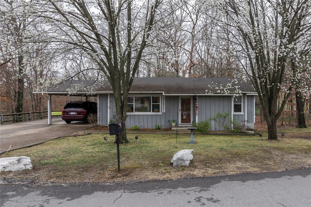 Great Investment opportunity in Beautiful Bella Vista. This home features 2 bedrooms and 1 and a half bathrooms. New paint throughout! The living room features laminate wood flooring. Spacious kitchen with stainless steel appliances and plenty of cabinet space. Outside enjoy the large corner lot and deck. New septic tank added in 2015!