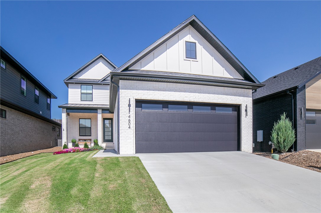 Absolutely stunning, one-year old, Shadow Valley show stopper! This home has numerous upgrades including Learning tankless, on demand water heater, epoxy garage floor, golf cart garage storage, full-yard sprinkler system, and custom Roller Shades, complete with remote controlled technology. The kitchen will be sure to please with double ovens, gas range, Frigidaire Professional Appliances, and Zephar hood vent with remote control. Quartz countertops and custom cabinet and drop down island lighting set this space apart from all others! No detail was left out, including the upgraded wiring. You'll enjoy Cat 6 throughout - 2 in the bonus room for games or movies! Prewired for 5.1 Surround in Living Room, 7.4.1 in Bonus. Complete Home Sonos! Covered patio hosts a built in grill and side burner/wok. Low maintenance yard - smart TURF backyard - antibacterial and antimicrobial - pet safe!  Close to hospitals, shopping, I-49, HWY 112, and central to all things NWA.