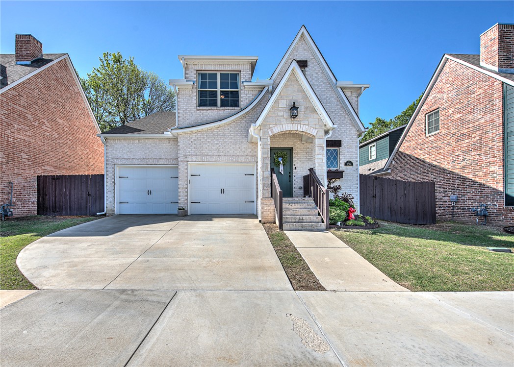 Beautifully maintained 4BR/2.5BA home in a prime Fayetteville location with a versatile layout and thoughtful upgrades. The main level features a spacious, light-filled living area that flows into the dining space and kitchen, perfect for everyday living and entertaining. Private primary suite on the main floor includes an en-suite bath and generous closet space. Upstairs offers 3 additional bedrooms ideal for guests, family, or office space. Convenient dual laundry areas on both levels. Enjoy the private backyard and covered patio with custom outdoor sound system. Located steps from Centennial Park walking and mountain biking trails, plus access to a community pool and park. Active neighborhood hosts regular events including playdates, Friday meetups, food drives, and Easter egg hunts. Lawn maintenance included. Convenient to schools, shopping, dining, and the University of Arkansas.
