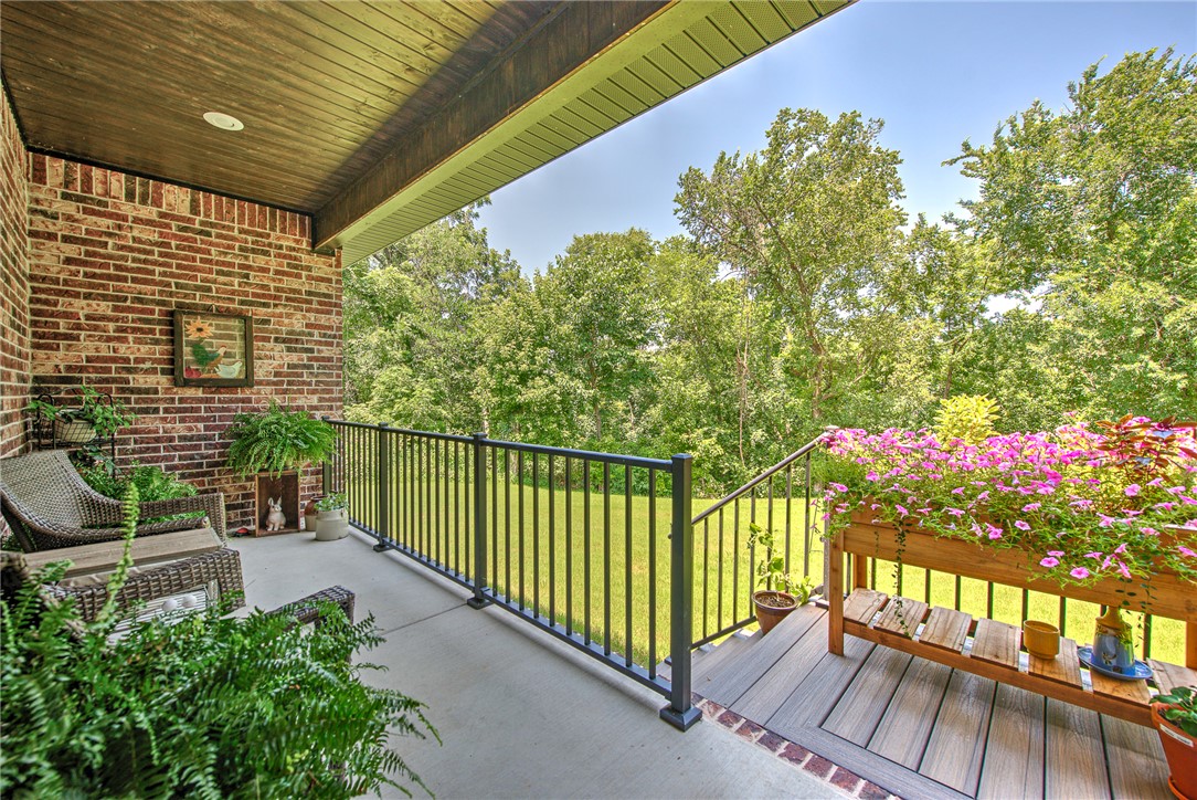 Completed in September 2025, this move-in-ready full-brick home offers the best of new construction without the wait. Thoughtfully designed with an open floor plan, dedicated office, and quality finishes throughout, you'll appreciate custom rift-sawn oak cabinetry, 3cm quartz countertops, under-cabinet lighting, upgraded appliances, luxury vinyl flooring, gas fireplace, spacious laundry room, and a spa-inspired tiled shower with dual shower heads and glass enclosure. The professionally landscaped, level lot features a large backyard and covered patio perfect for relaxing or entertaining while enjoying peaceful wildlife views. Ideally located less than five minutes from Branchwood Recreation Center, Highlands Golf Course, and Bella Vista amenities, with I-49 nearby for quick access to Bentonville and only eight miles to Walmart. Quality craftsmanship, exceptional location, and truly move-in ready!