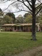 Perfect little mini farm in the City Limits of Atkins, well kept brick 3 br/ 2 ba/ extra room,  brick home with oversized single garage, storage.  There is a 30x50 metal shop building on concrete slab with 15' ft overhead door, double garage door, wired for shop.  Beautiful lot with scattered  trees and flowers, two other barns/buildings,On line auction scheduled and all furnishings will be out of house and shop by April 24;House will not be auctioned.