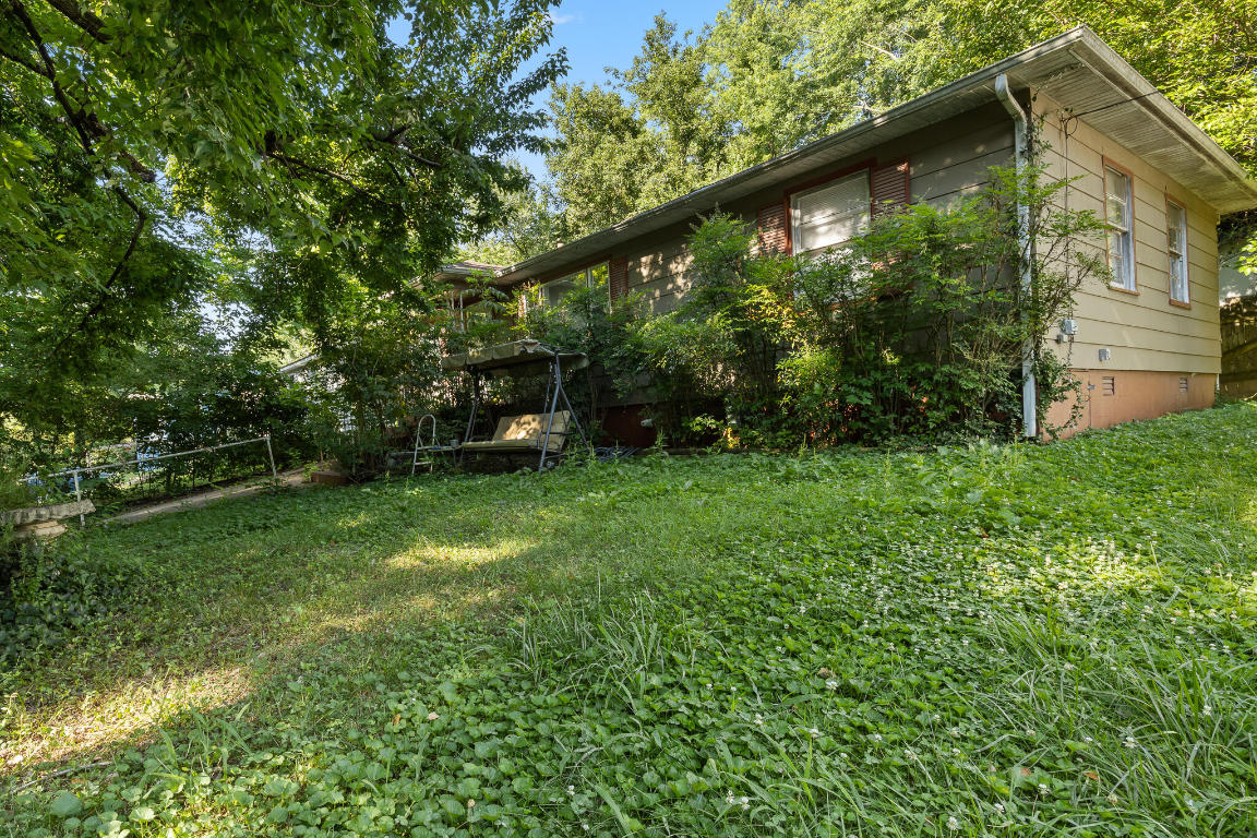 Check out this cozy home in a well established neighborhood. This is a  3 Bedroom 1 bath bungalow style home with tons of character and it has a sunroom that can easily be converted into a fourth bedroom if needed. Two out buildings on the property. This property also includes the area across the street for additional parking if needed.
