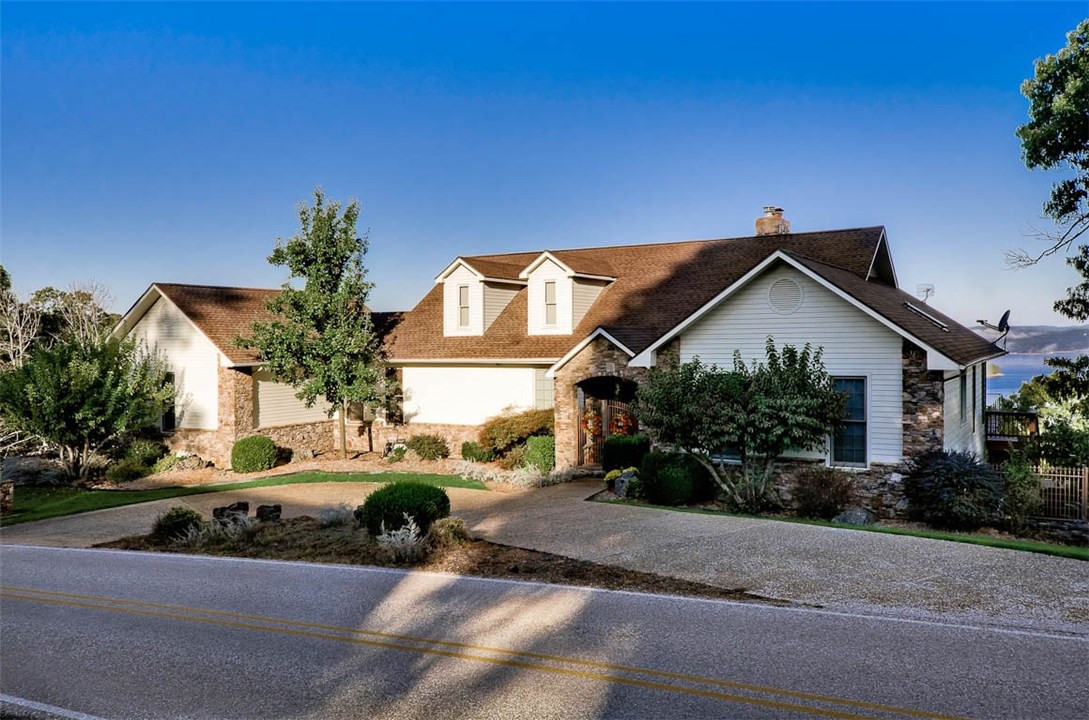 Fabulous home with Million dollar lake view! This home is located just 15 mins from Historic Eureka Springs and 30 mins from Rogers, AR on Beautiful Beaver lake. Starkey Marina and the Dam are only 5 mins away. Home features aggregate drive, 2 X 6 ext. walls, lg. kit. with granite countertops, second kitchenette in lower level, large open rooms, finished beam ceilings, lg. pantry complete with electric dumbwaiter to lower level, security system, safe room and incredible lake views from almost every room.