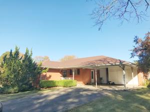 The space you need for the price you want!  This large home offers a family room, living room, three bedrooms, two full bathrooms, in over 1800 SqFt! You'll love the extra room inside to spread out and enjoy life.  There is plenty of storage including  a detached carport with an enclosed workshop, large closets, and a covered area for your tools. The corner lot offers a large backyard that is privacy fenced.