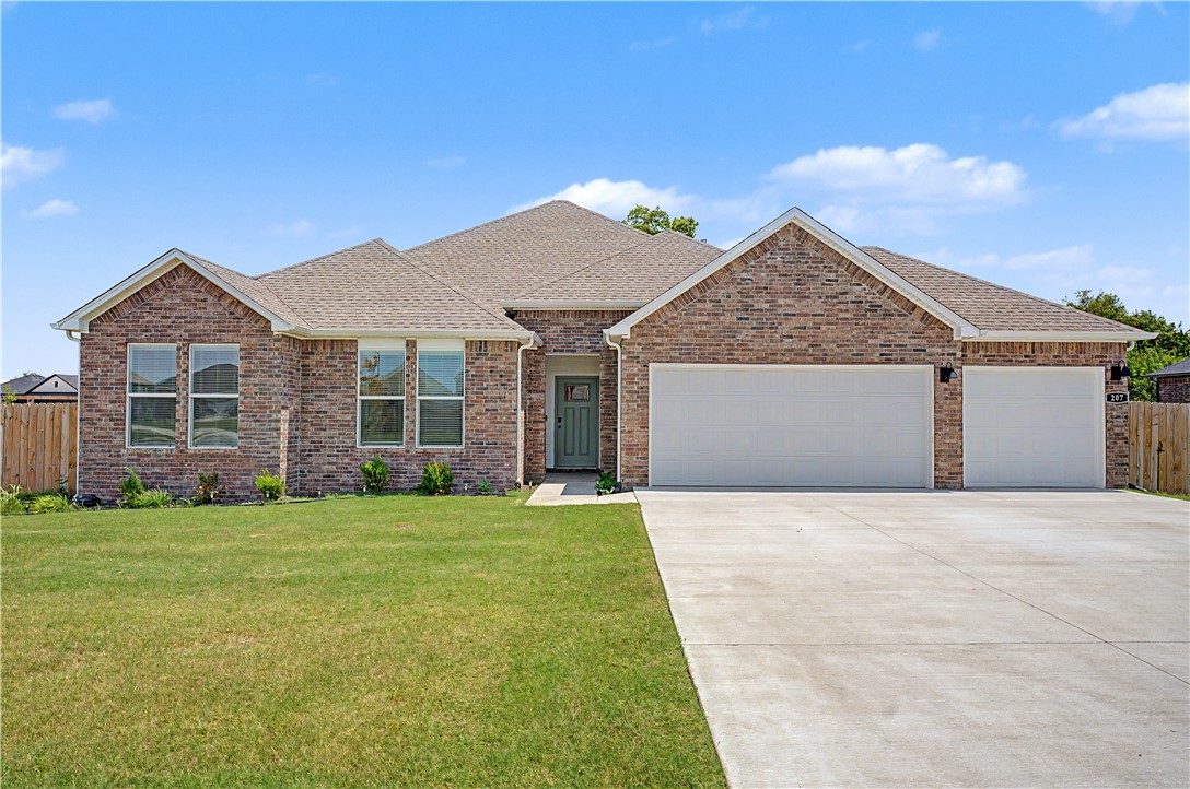 Built in 2025, in a quiet subdivision just outside town, with quick access to Hwy 412, a prime corner lot, backed up to a greenway, newly graded and landscaped yard, lived in just long enough to correct any builder imperfections! High end fixtures, quartz countertops, soft close cabinets, gas range with a grill top, luxury vinyl plank flooring, new land scaping, 3 car epoxy coated garage floor, large pantry, extra storage behind island, mood setting electric insert fireplace, and HUGE primary walk-in closet. A top-tier property with hard to beat quality!