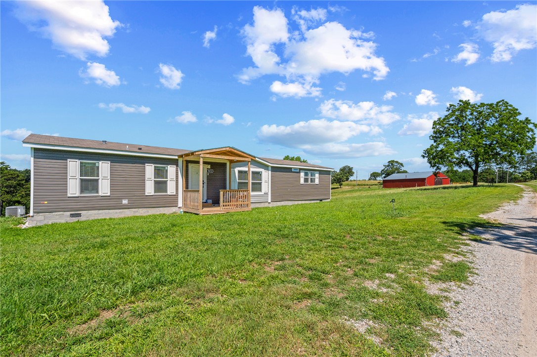 Move-in ready 3-bedroom, 2-bath manufactured home situated on 7 beautiful acres in Omaha, AR. This home features an open floor plan, spacious kitchen, split-bedroom layout, and a private primary suite. Enjoy peaceful country living with plenty of room for animals, gardening, or outdoor recreation. Conveniently located with easy access to Branson and Bull Shoals Lake, this property offers the perfect blend of comfort, privacy, and space. Don't miss this opportunity to own your own slice of the Ozarks! More pictures to come , Stay Tuned!!!