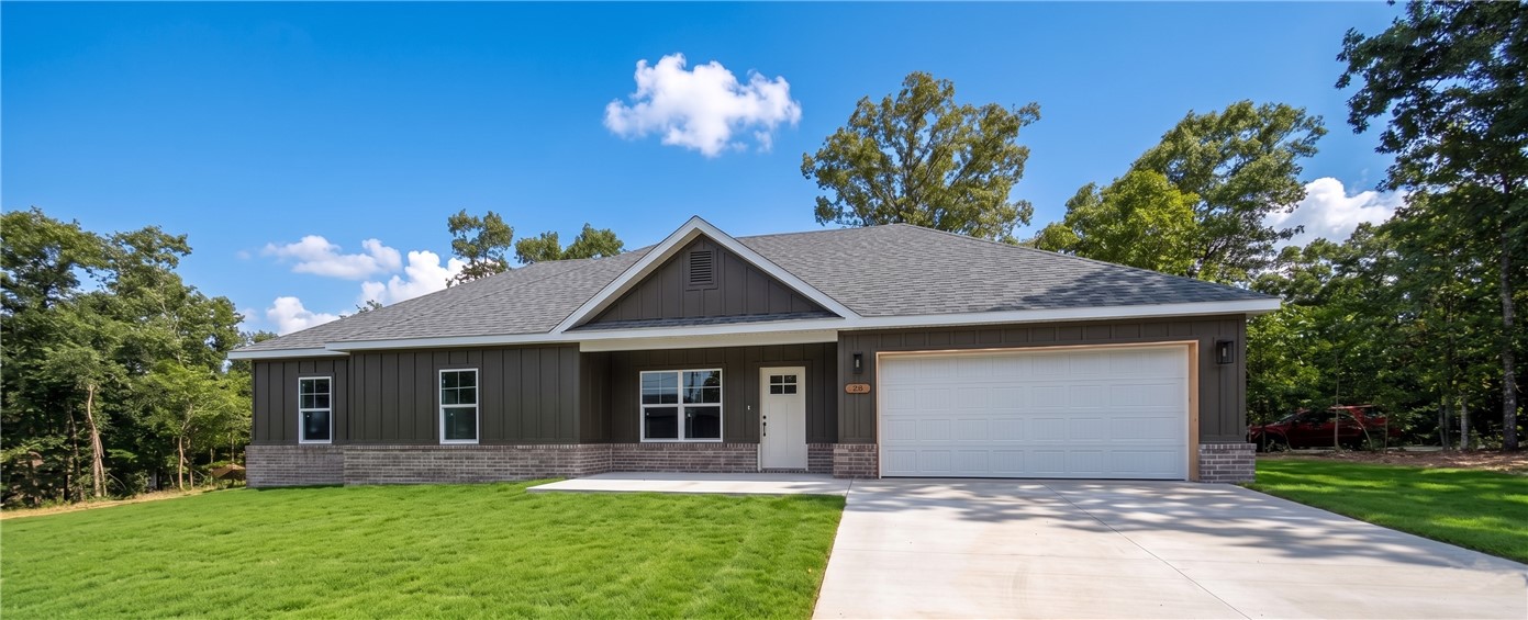 This stunning residence combines contemporary board and batten design with a classic brick skirt, offering premier curb appeal near Highlands Golf Course and the shores of Loch Lomond. Sitting on almost a half-acre of land, this property boasts an expansive backyard with endless possibilities—whether you want to build a massive detached shop, or simply need tons of room for the kids and fur babies to run and play. This move-in-ready gem perfectly blends high-end finishes, incredible outdoor freedom, and an unbeatable Bella Vista location.