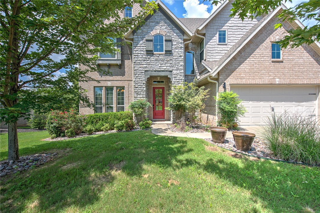 Perched in the desirable Sloan Estates subdivision in East Fayetteville, this beautiful 5-bedroom, 3.5-bathroom brick home offers 3,315 sq. ft. of thoughtfully designed living space. The main level welcomes you with bright interiors, a cozy fireplace in the living room, and a large eat-in kitchen complete with double ovens, a gas cooktop, a spacious pantry, and premium finishes. The primary suite serves as a main-level retreat featuring a spa-like bath and a soaking tub. Upstairs, you will find four additional bedrooms, two full baths, and a massive bonus room perfect for a theater or play area. Step outside to enjoy the peaceful backyard from the covered patio, the hot tub or the second-level balcony deck—perfect for taking in scenic views. The home is located in the back of the neighborhood, offering privacy and quaint quietness for nights on the deck! Complete with a 3-car attached garage and an unbeatable location blending neighborhood tranquility with quick city convenience.  Schedule your tour today!