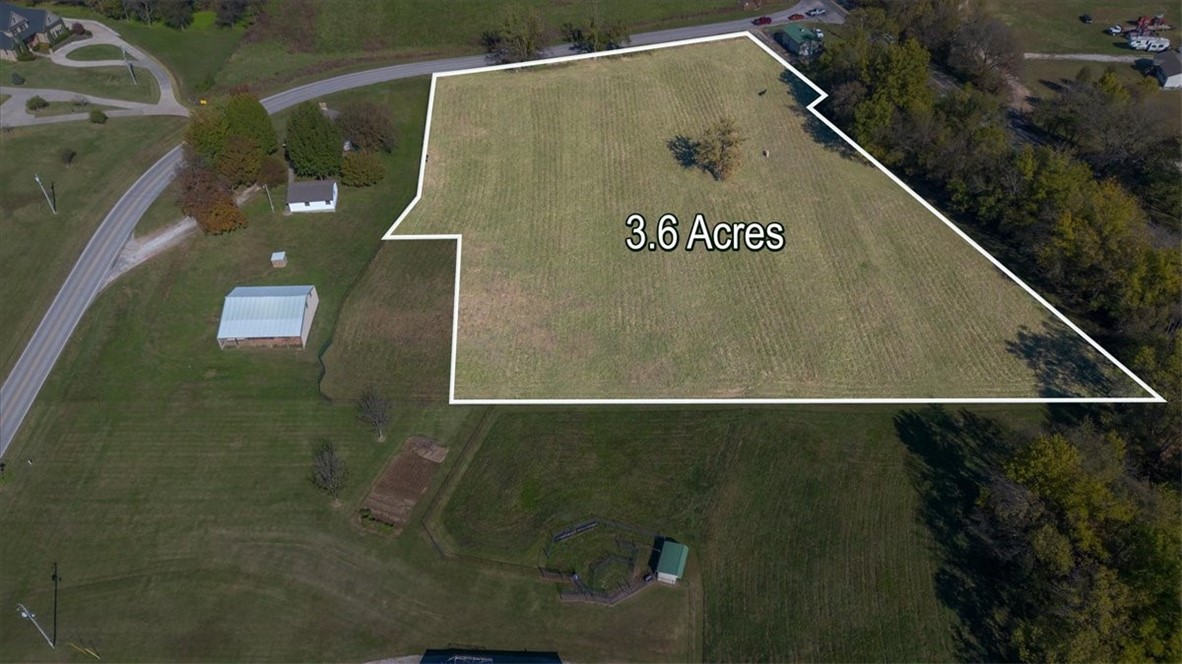 Beautiful 3.6+/- acre residential tract in prime Tontitown location!  Discover the perfect blend of country charm and city convenience with this 3.609+/- acre parcel on North Barrington Road.  Zoned Residential Estates, this gently sloping property offers versatile opportunities.  Develop into three separate lots or enjoy it as one spacious homesite with plenty of room for your dream home, garden, and even horses to graze.  Utilities (water and electric) are available at the street, and access is easy with a paved public road frontage.  The property's slightly elevated terrain provides a picturesque setting with plenty of usable space.  Located just down the road from Tontitown Winery, this land sits in a desirable area only minutes from the hwy. 612 on ramp, providing quick access to all of NWA and just 8 miles from XNA airport.  Bring your building and vision, this is a rare opportunity to own a beautiful piece of land in one of NWA's most convenient and scenic locations!