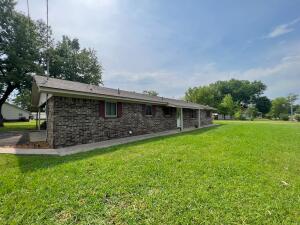 This BEAUTIFUL 3 bedroom 2 bath home with a 3-car attached carport is conveniently located on the edge of the Clarksville city limits.  Bedroom closets have built-in shelving, large closet in entry way, laundry room, and outbuilding.  The outbuilding is wired with electricity and is ready to be used as a work shop. The roof is less than a year old, and HVAC is only 5 years old. GEORGOUS fireplace in the living room that is wired for gas but is currently being used as wood burning. Sit back and relax outside on the covered patio area.  Call and schedule your showing, this home won't last long.