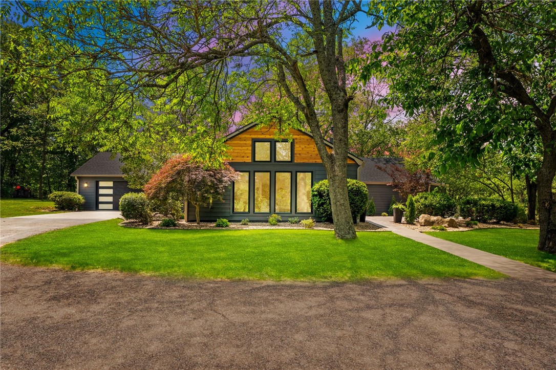 This stunning, fully-remodeled home blends impeccable modern-organic design with thoughtful functionality on 5.24 secluded acres. Every inch has been reimagined, from the updated floor plan, now featuring an added bedroom with en-suite bath and a welcoming new entryway, to the top-to-bottom renovations including new electrical, plumbing, septic system, windows, flooring, cabinetry, countertops, and paint. The kitchen is a showstopper, boasting expansive luxe countertops, custom cabinetry, and a hidden butler’s pantry to keep your workspace pristine. Step onto the oversized 450 sq ft stamped concrete patio and start dreaming…there's even a pool rendering off the back deck to spark your imagination. A whole-house generator adds peace of mind, while a new mini-split HVAC keeps the nearly 300 sq ft bonus space behind the garage, ideal for a gym or office, comfortable year-round.This is more than your basic remodel…it’s unforgettable.